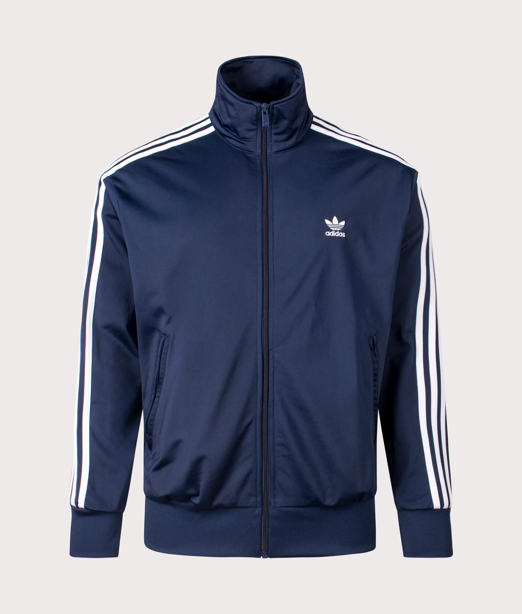 The adidas Originals Firebird Track Top in night indigo. Front shot at EQVVS.
