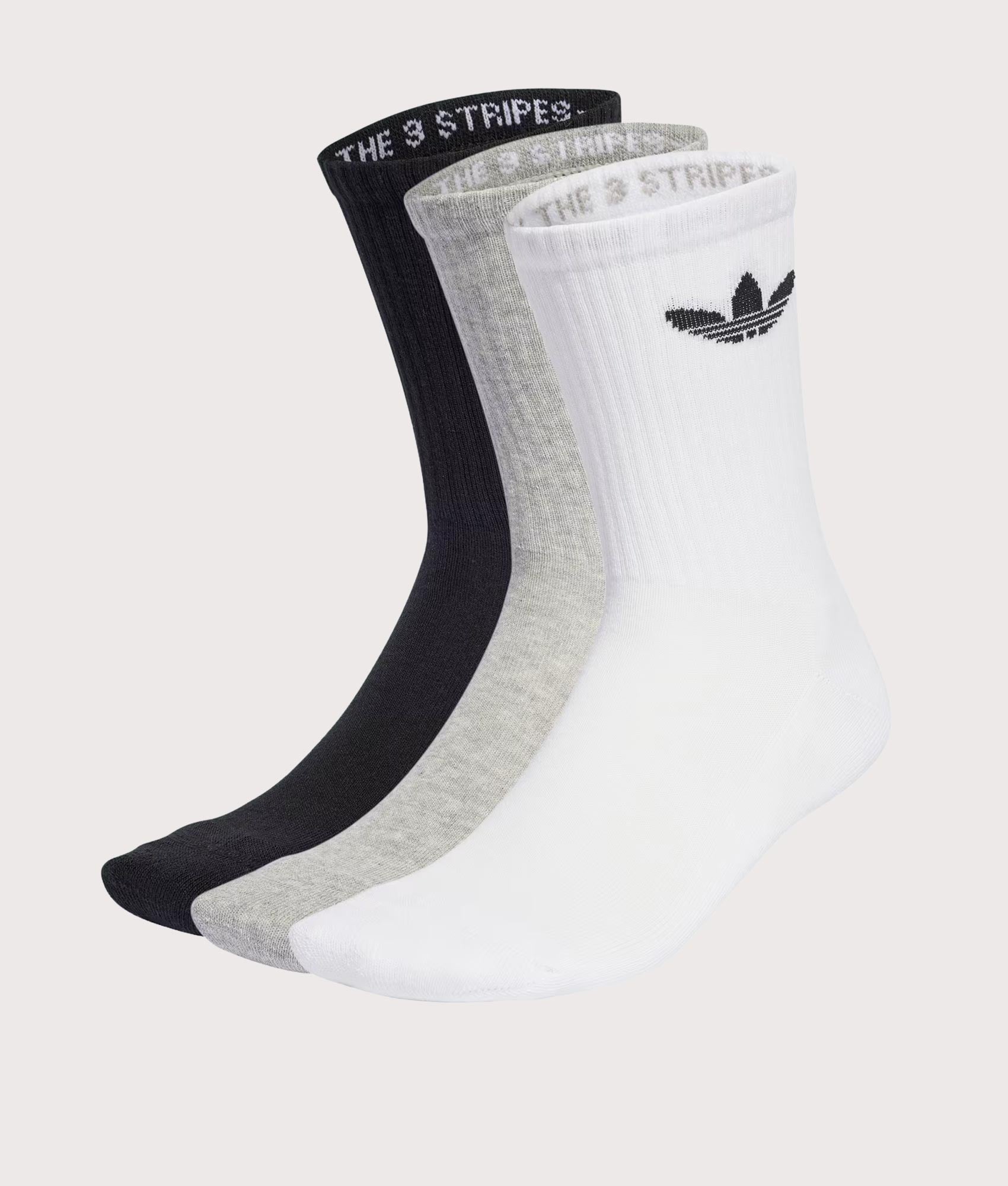 adidas Originals 3 Pack Trefoil Cushion Crew Socks in White/Medium Grey Heather/Black at EQVVS Menswear. Angled front shot.