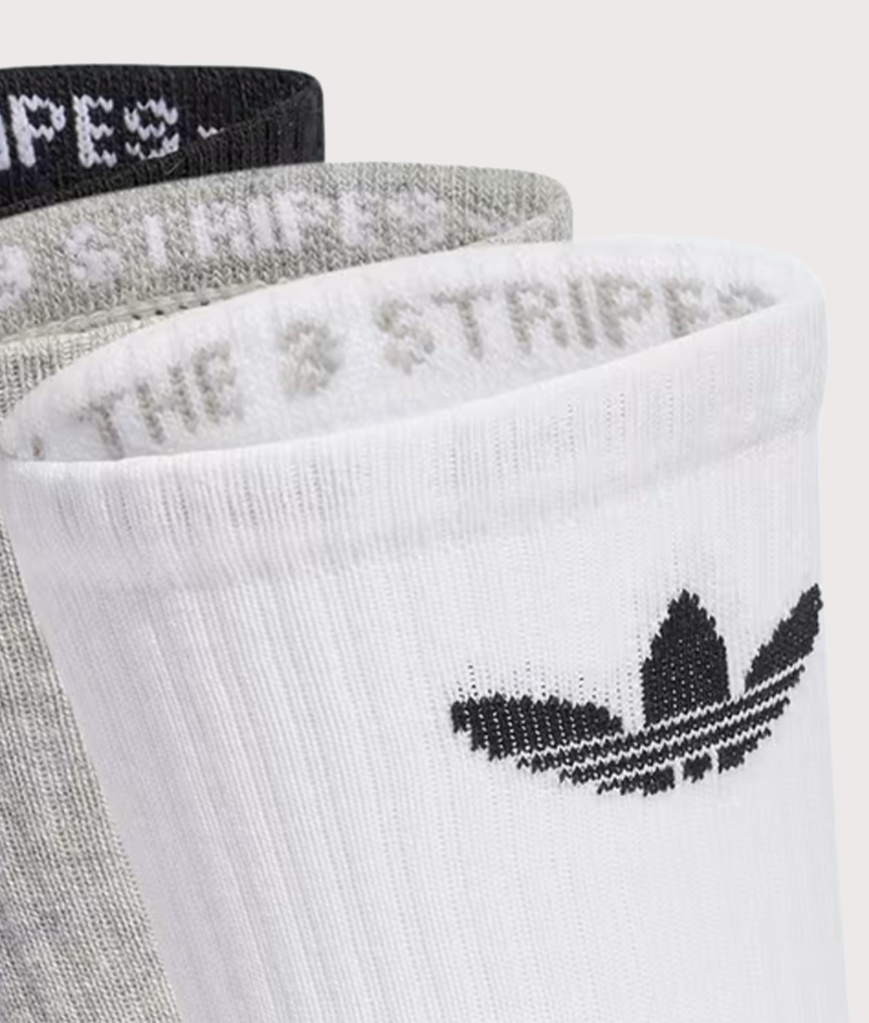 adidas Originals 3 Pack Trefoil Cushion Crew Socks in White/Medium Grey Heather/Black at EQVVS Menswear. Detail shot.