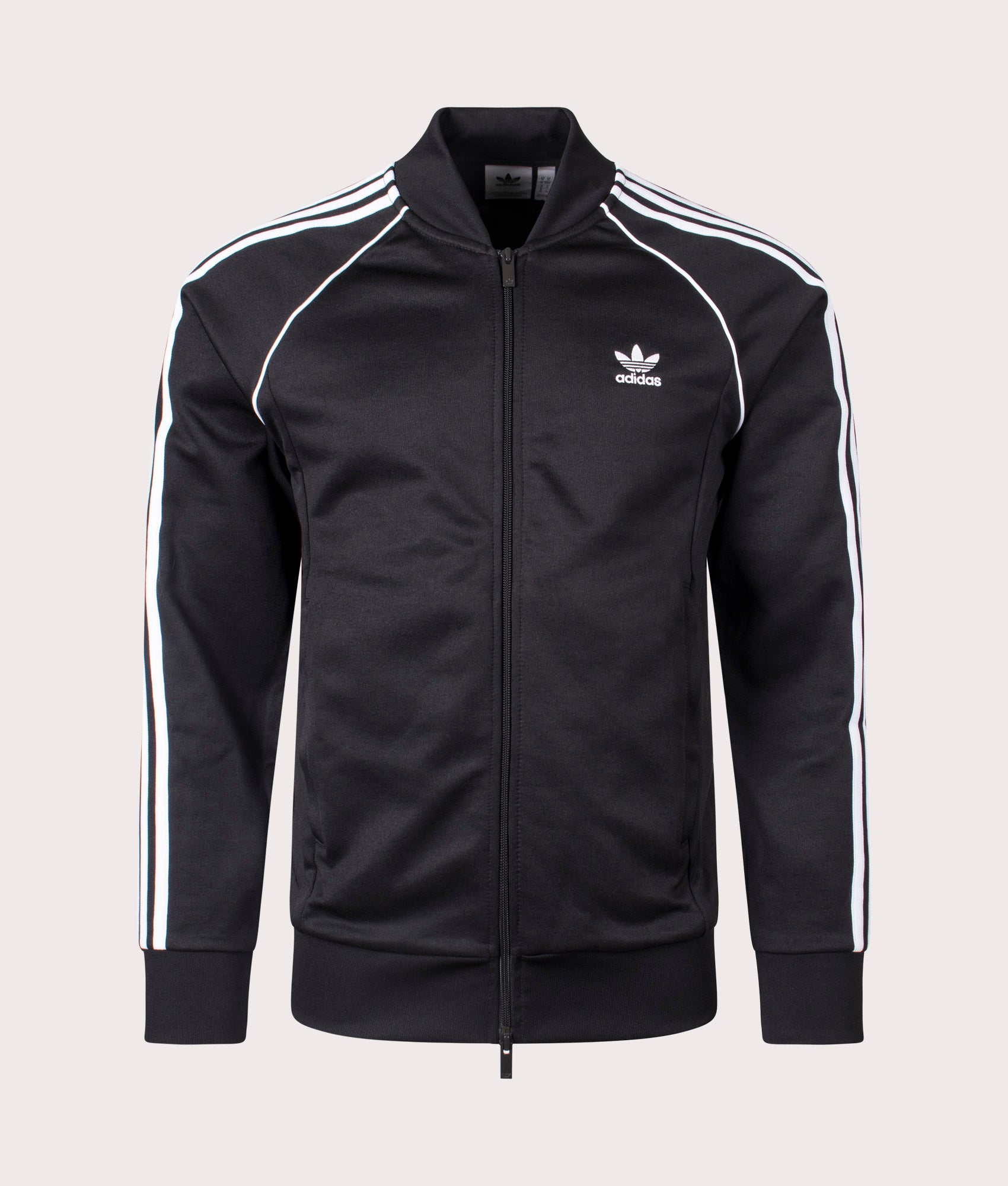 Adidas Originals Slim Fit Adicolor Classics SST Track Top in Black/White. Shot at EQVVS.  Front detail shot