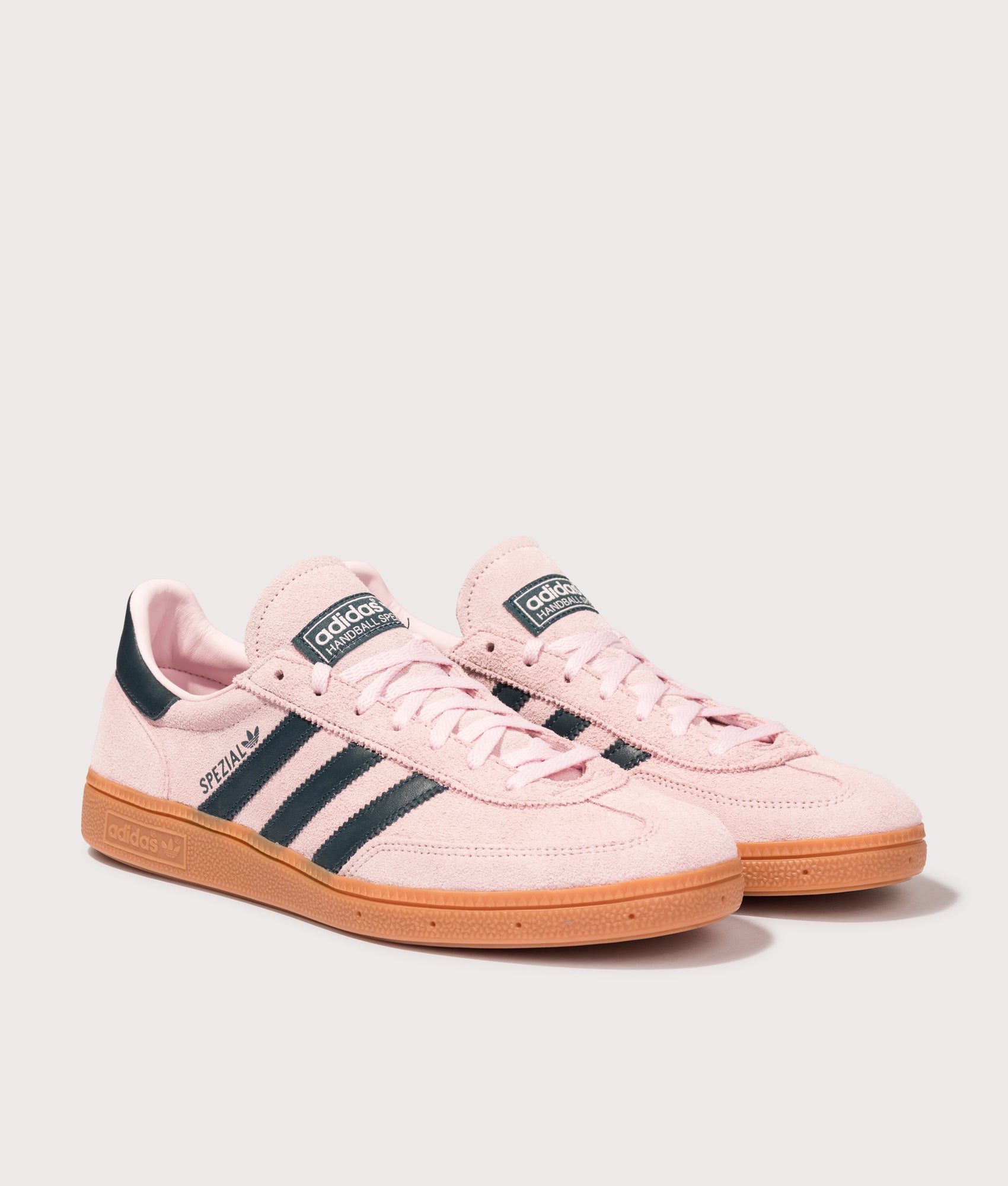 adidas Originals Handball Spezial Trainers in Clear Pink, Arctic Night and Gum at EQVVS Menswear. Angled front shot.