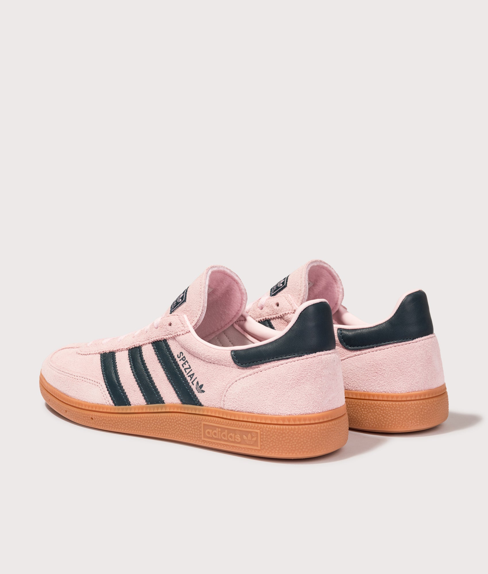 adidas Originals Handball Spezial Trainers in Clear Pink, Arctic Night and Gum at EQVVS Menswear. Angled back shot.