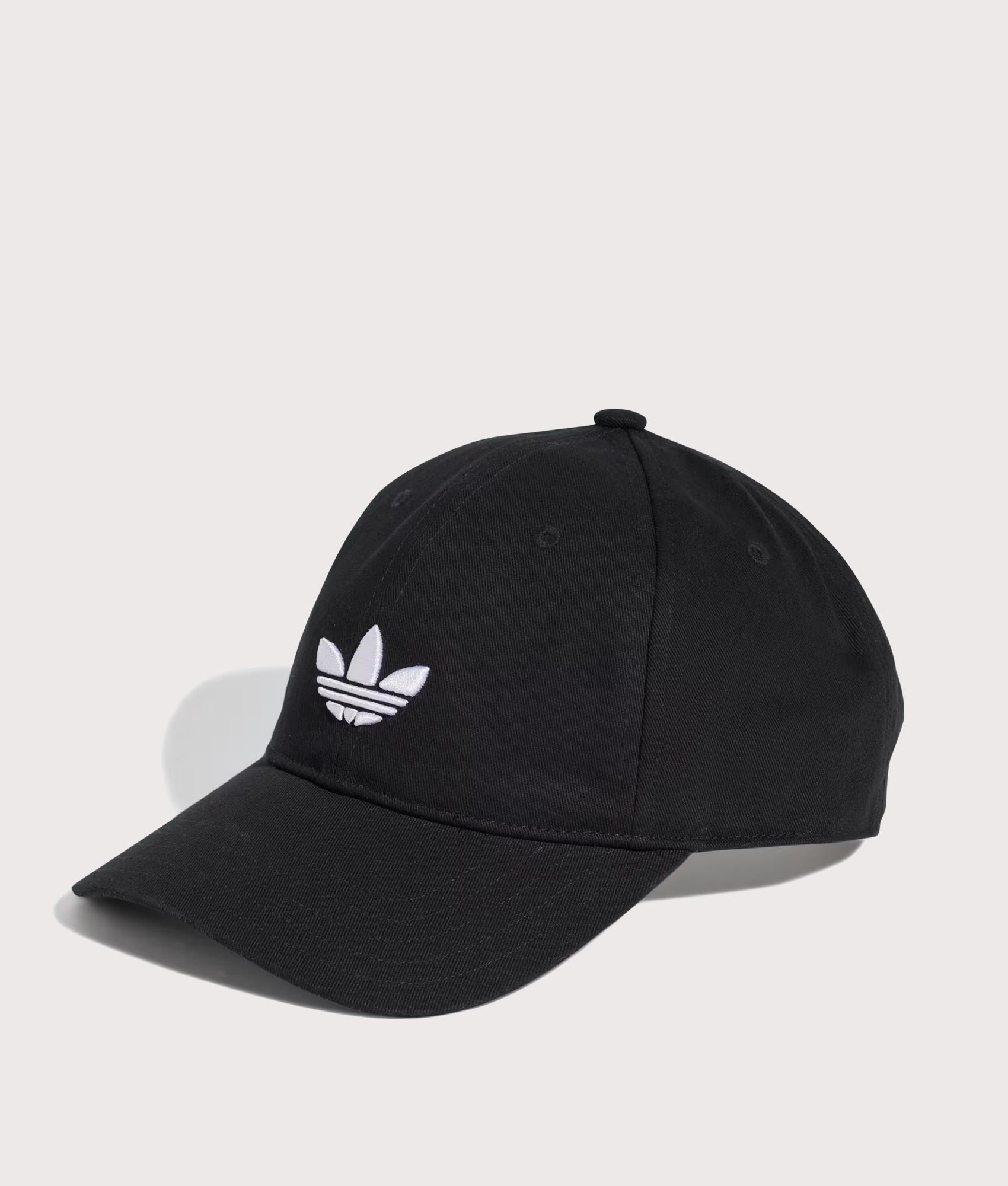 adidas Originals Adicolor Classic Trefoil Baseball Cap in Black at EQVVS Menswear. Angled front shot.