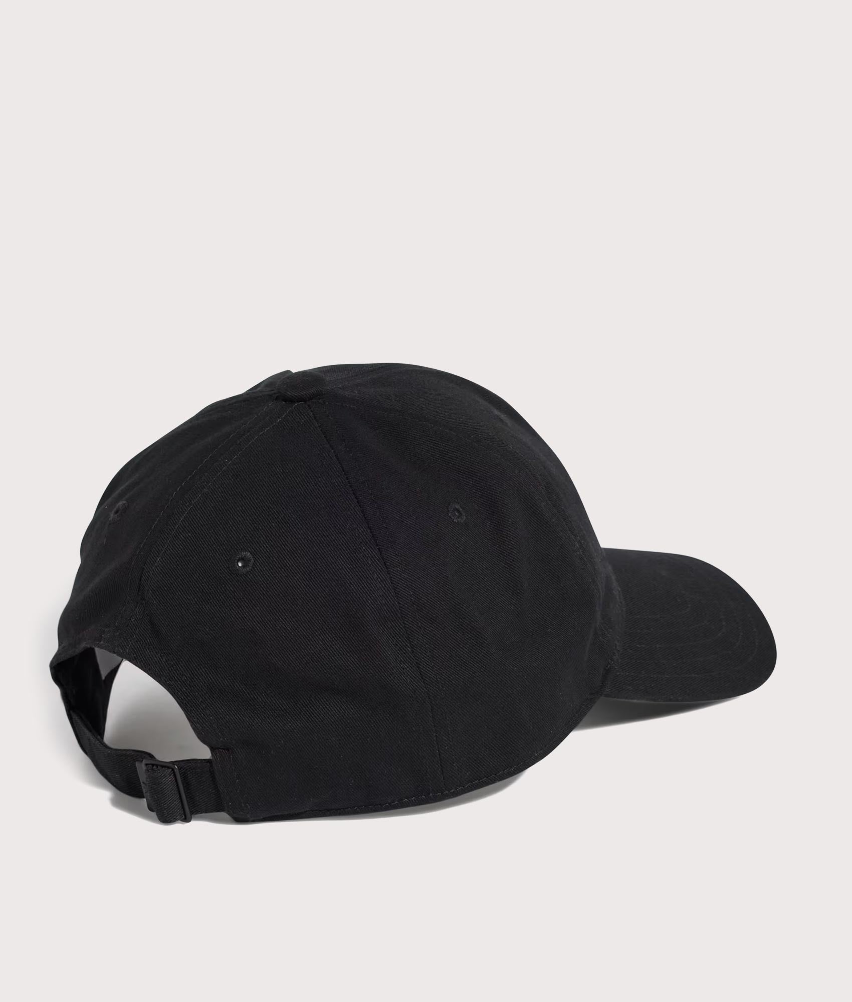 adidas Originals Adicolor Classic Trefoil Baseball Cap in Black at EQVVS Menswear. Angled back shot.