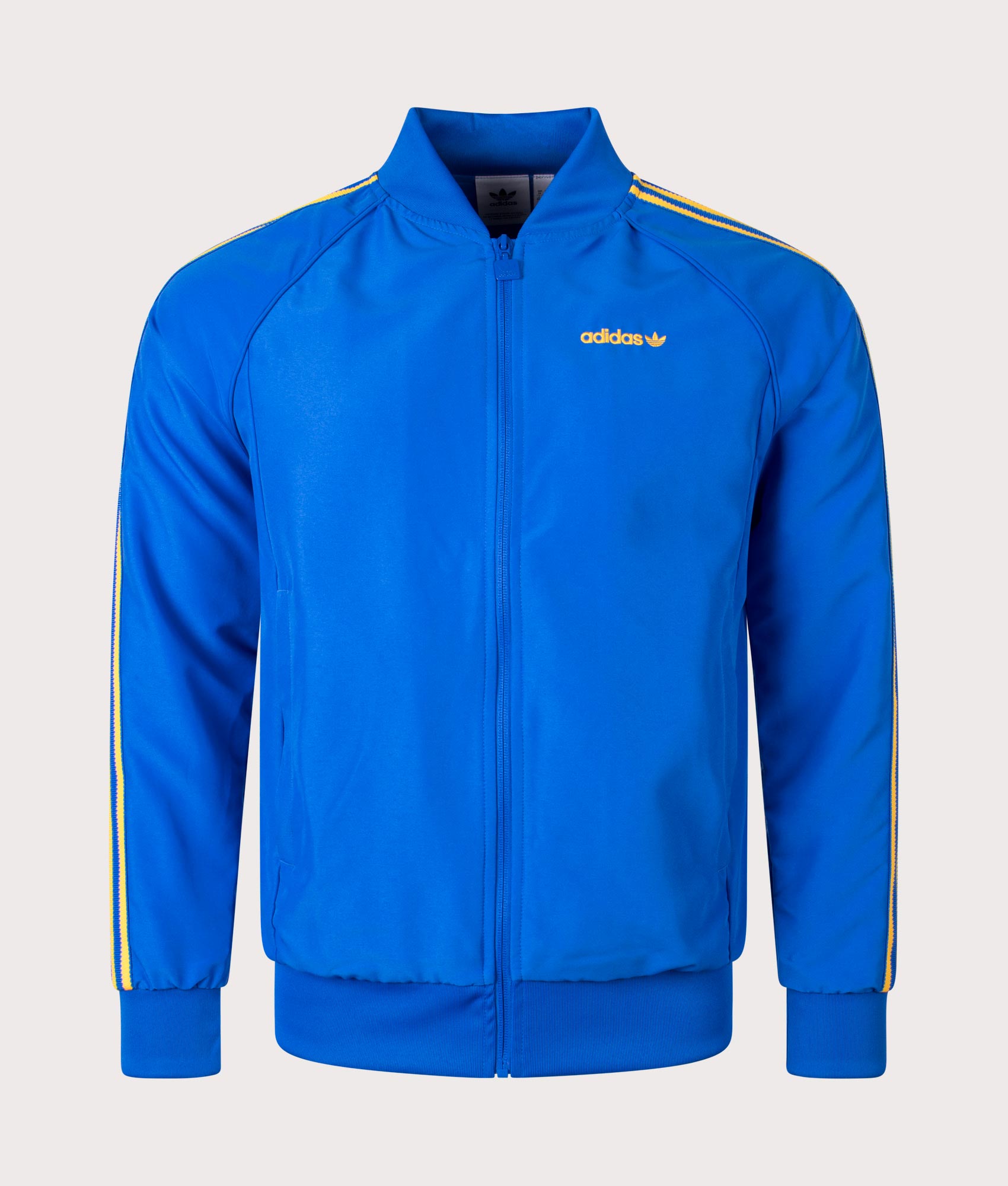 adidas Originals SST Track Top in Blue at EQVVS. Front Shot. 