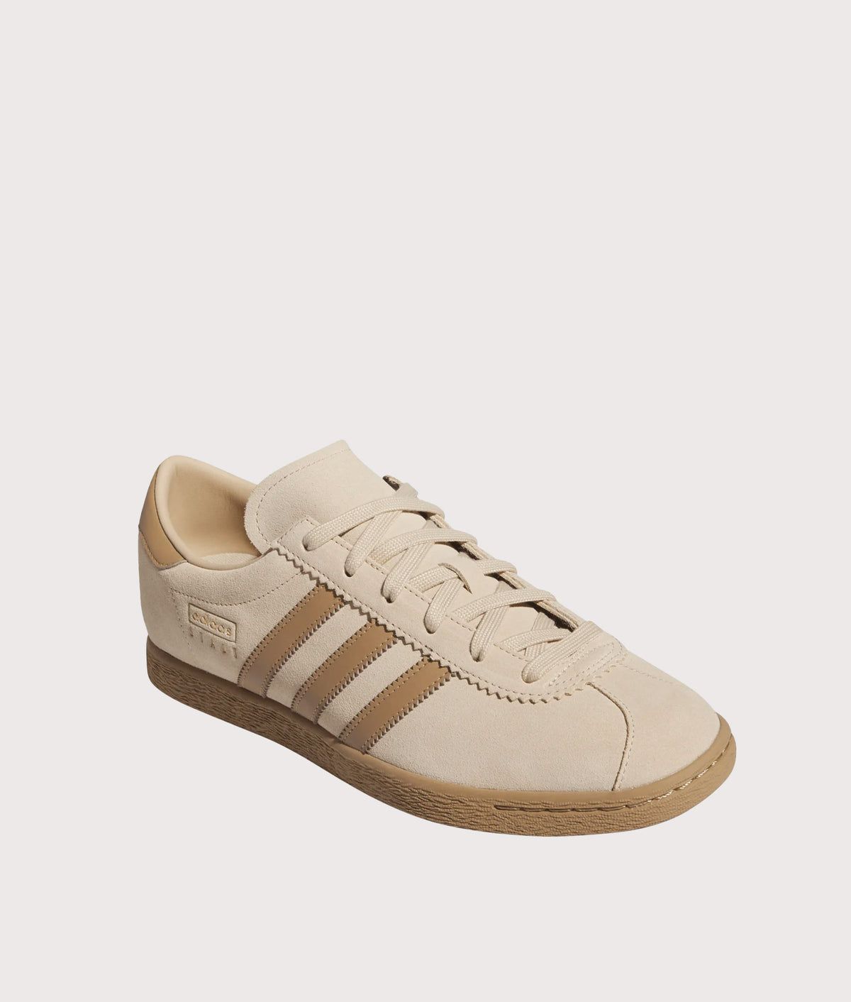 adidas Originals Stadt Trainers in Magic Beige, Cardboard and Gold Metallic at EQVVS Menswear. Angled front shot.