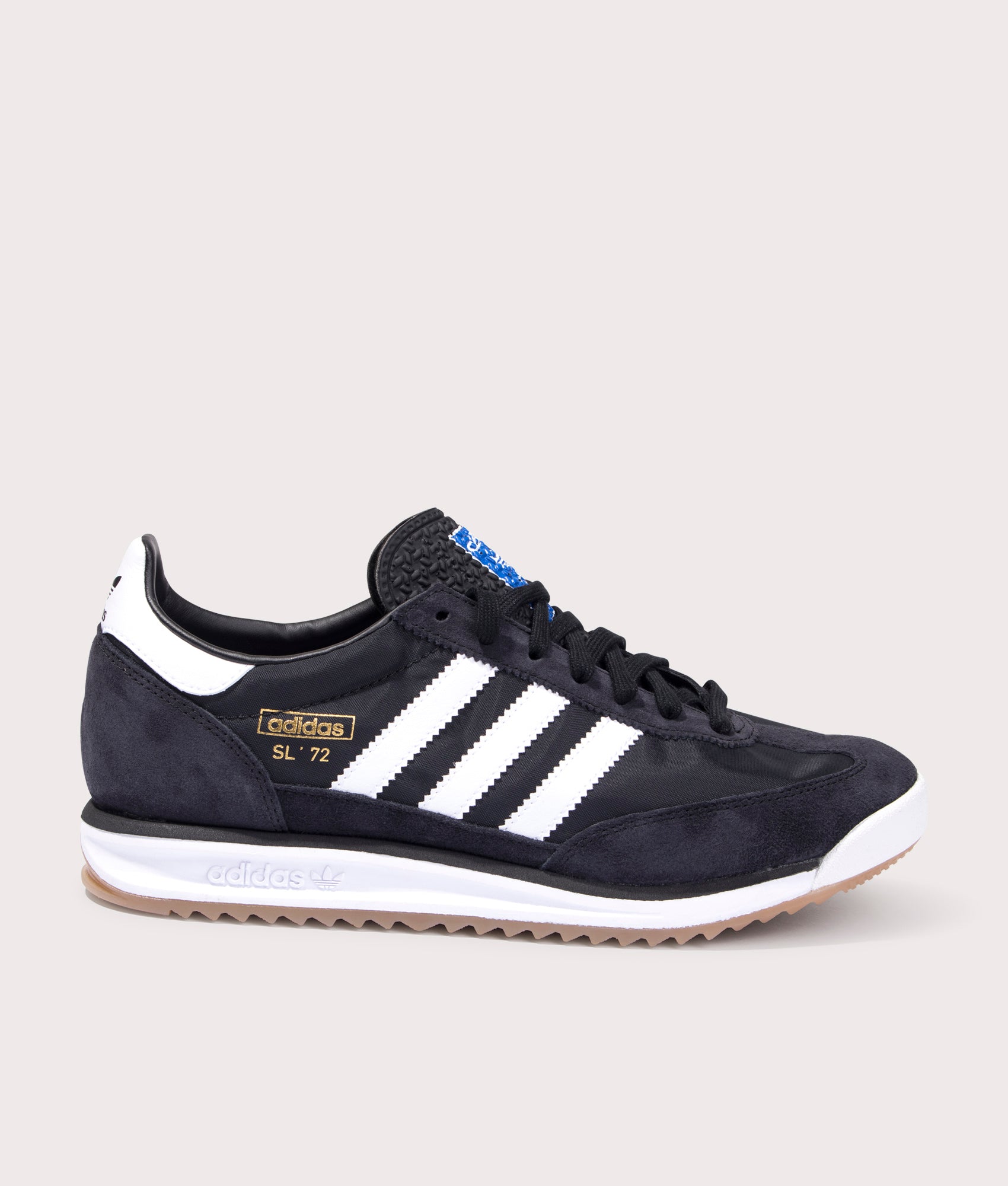 Adidas Originals SL 72 RS Trainers in Core Black/Footwear White/Blue at EQVVS. Side solo shot. 