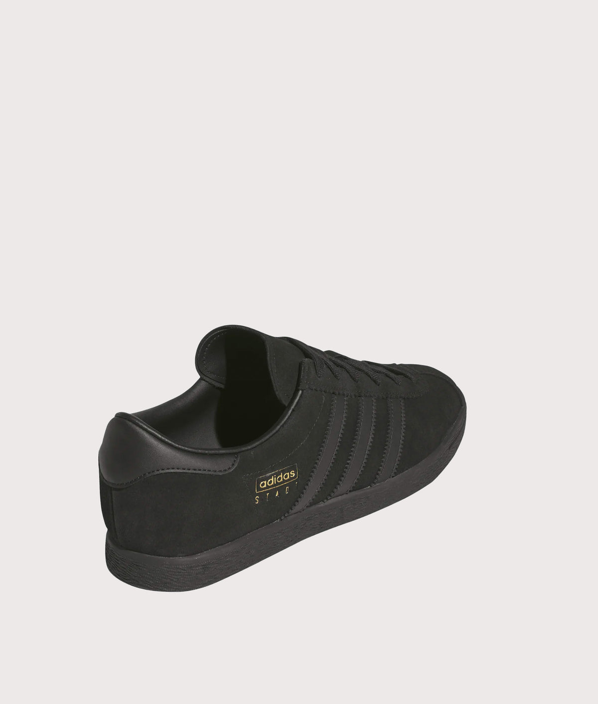 adidas Originals Stadt Trainers  in the Core Black, Core Black and Carbon at EQVVS Menswear. Angled back shot.