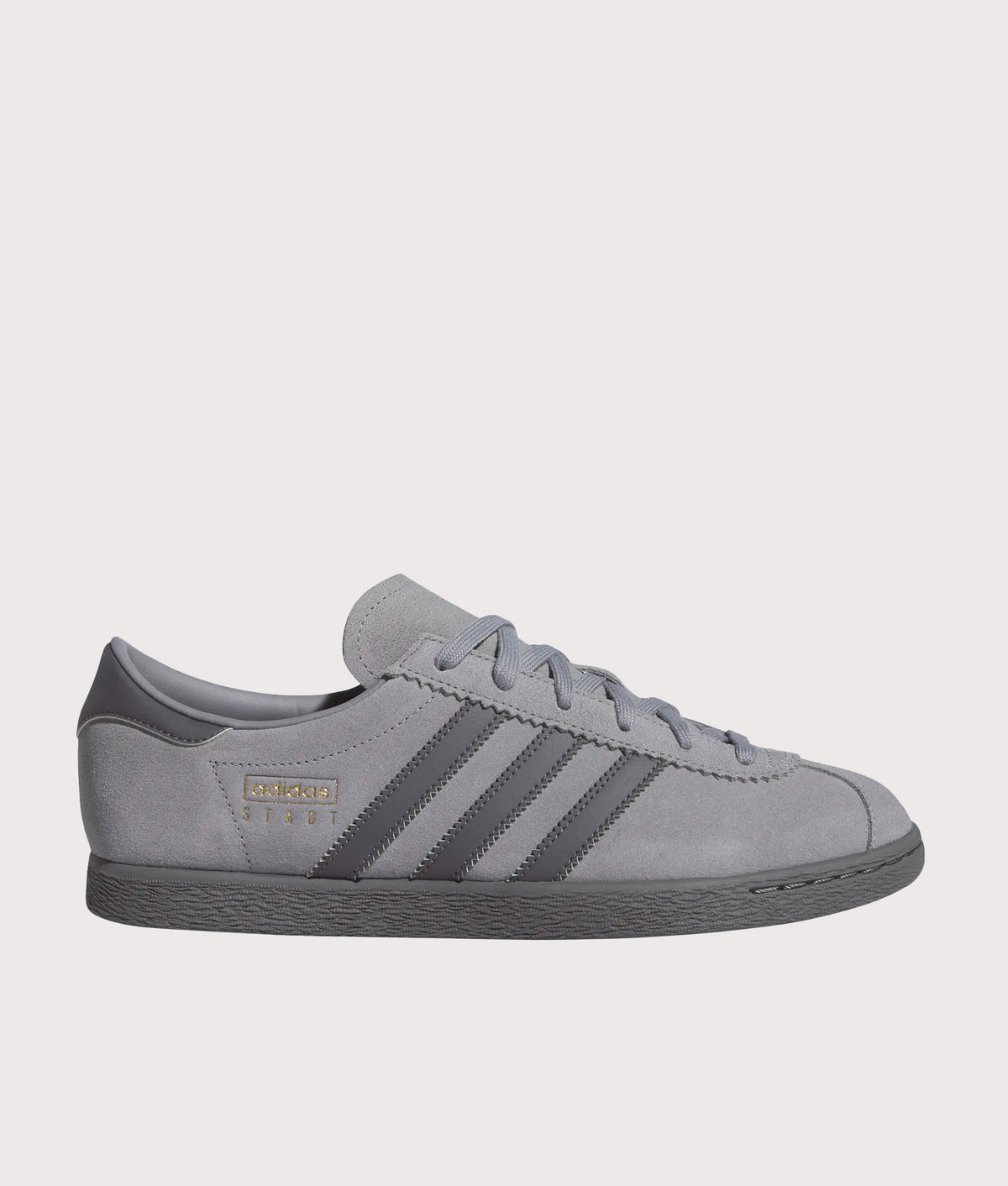 adidas Originals Stadt Trainers in Grey Three, Grey Five and Gold Metallic at EQVVS Menswear. Side shot.