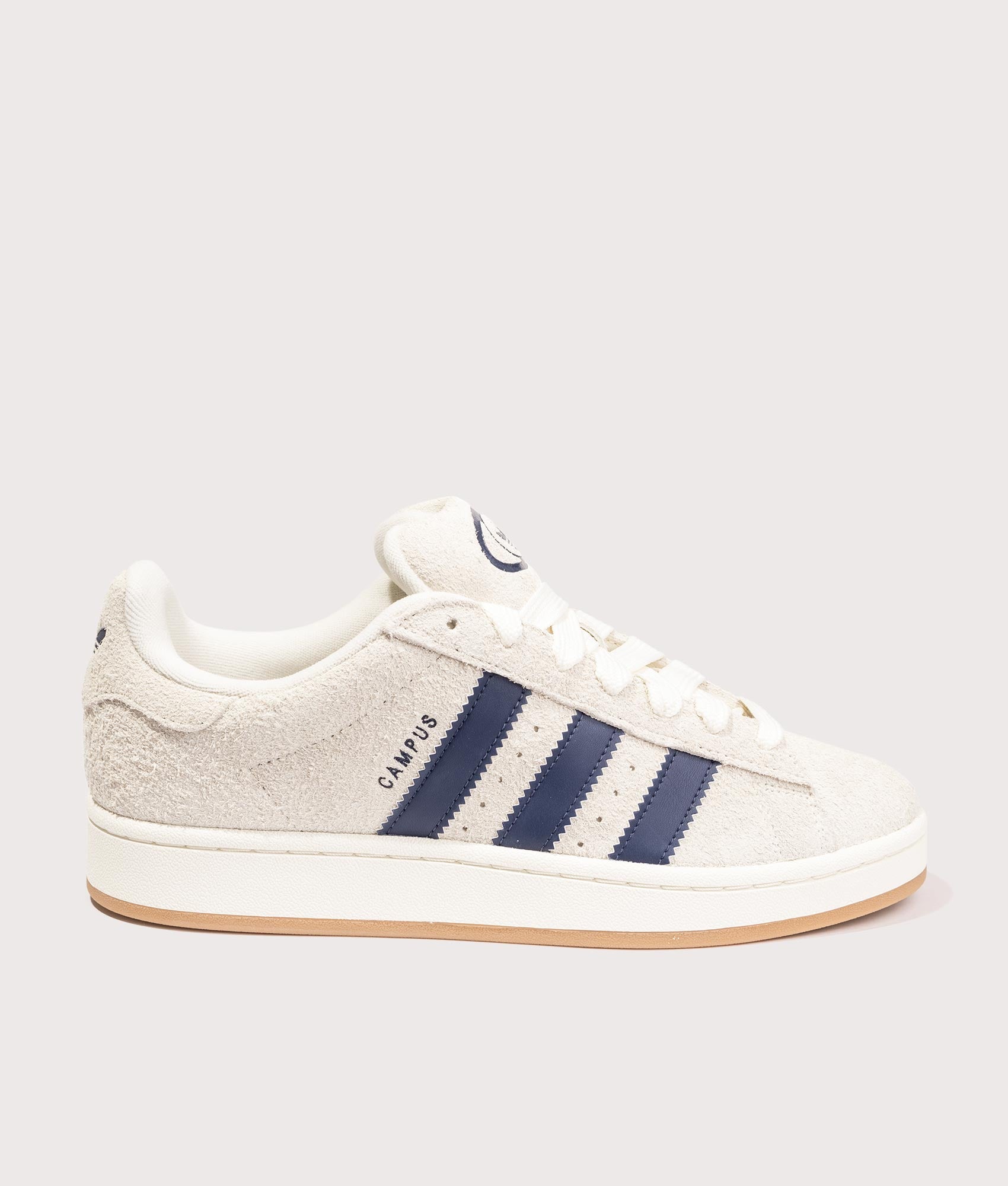 adidas Originals Campus 00s Trainers in Cream White/ Dark Blue/ Off White, 100% Leather and Rubber at EQVVS. Side solo shot. 