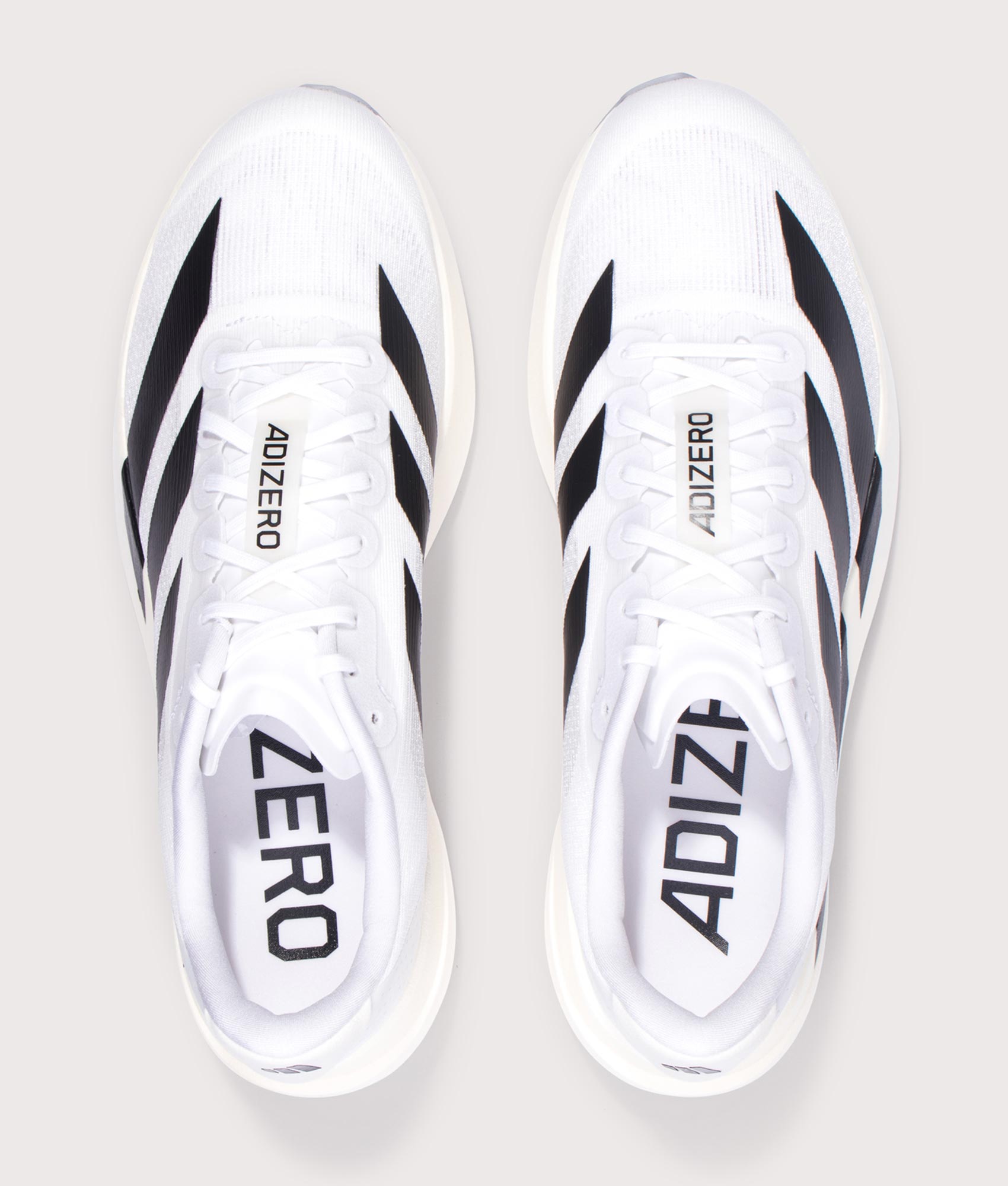 adidas Originals Adizero Evo SL Trainers in Cloud White/Core Black/Cloud White at EQVVS Menswear. Top shot. 