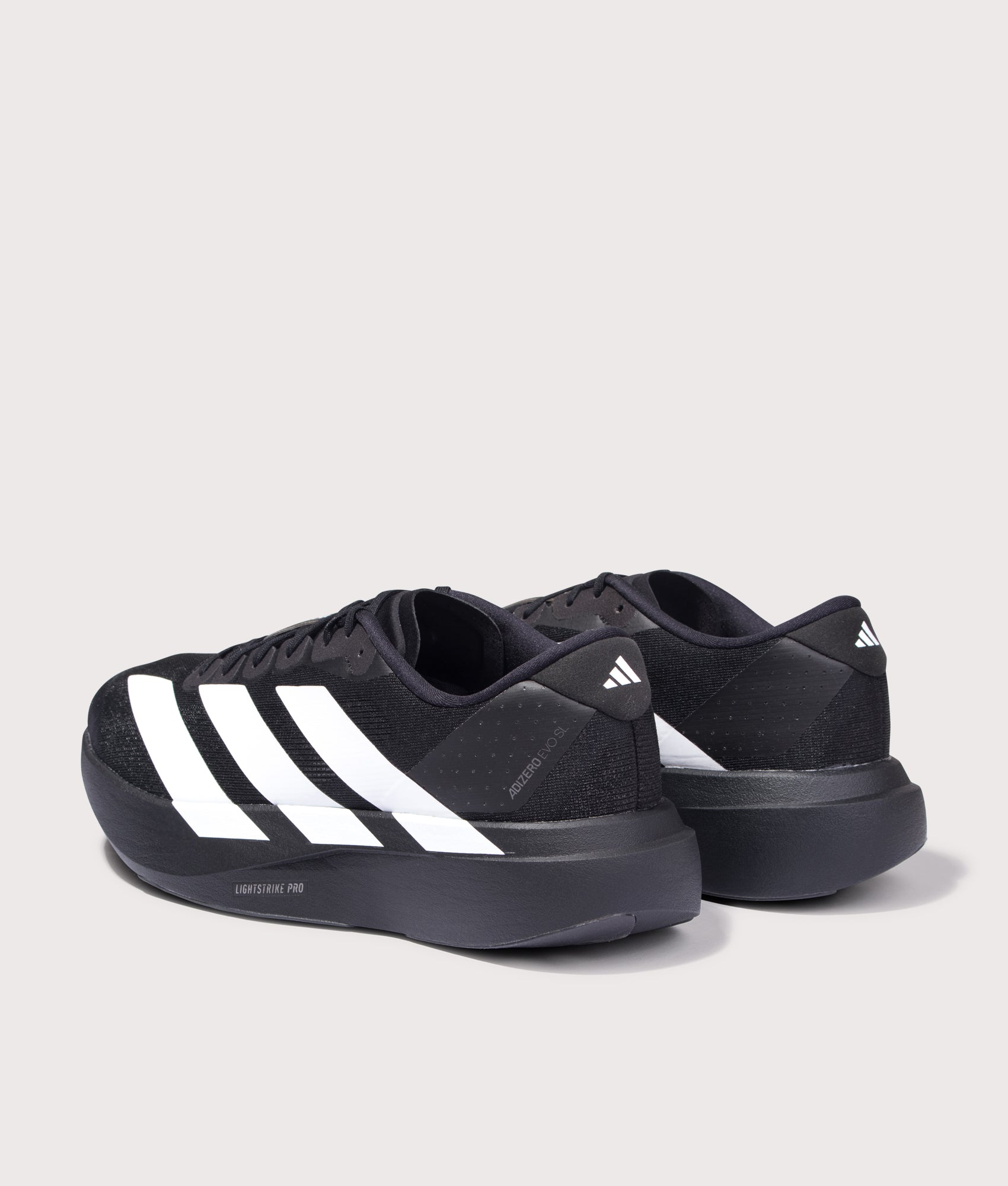 Adizero Evo SL Trainers in Core Black/Cloud White | adidas Originals | EQVVS | Back angle shot 