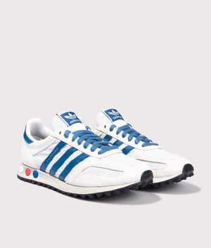 Adidas Originals LA Trainers in Off White, Dark Marine and Crystal White at EQVVS Menswear. Angled front shot.