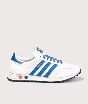 Adidas Originals LA Trainers in Off White, Dark Marine and Crystal White at EQVVS Menswear. Side shot.