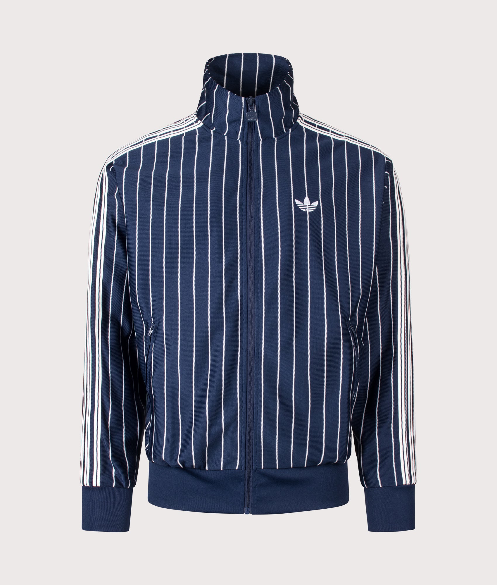 adidas Originals Loose Fit Firebird Pinstripe Track Top in Night Indigo at EQVVS Menswear. Front shot.