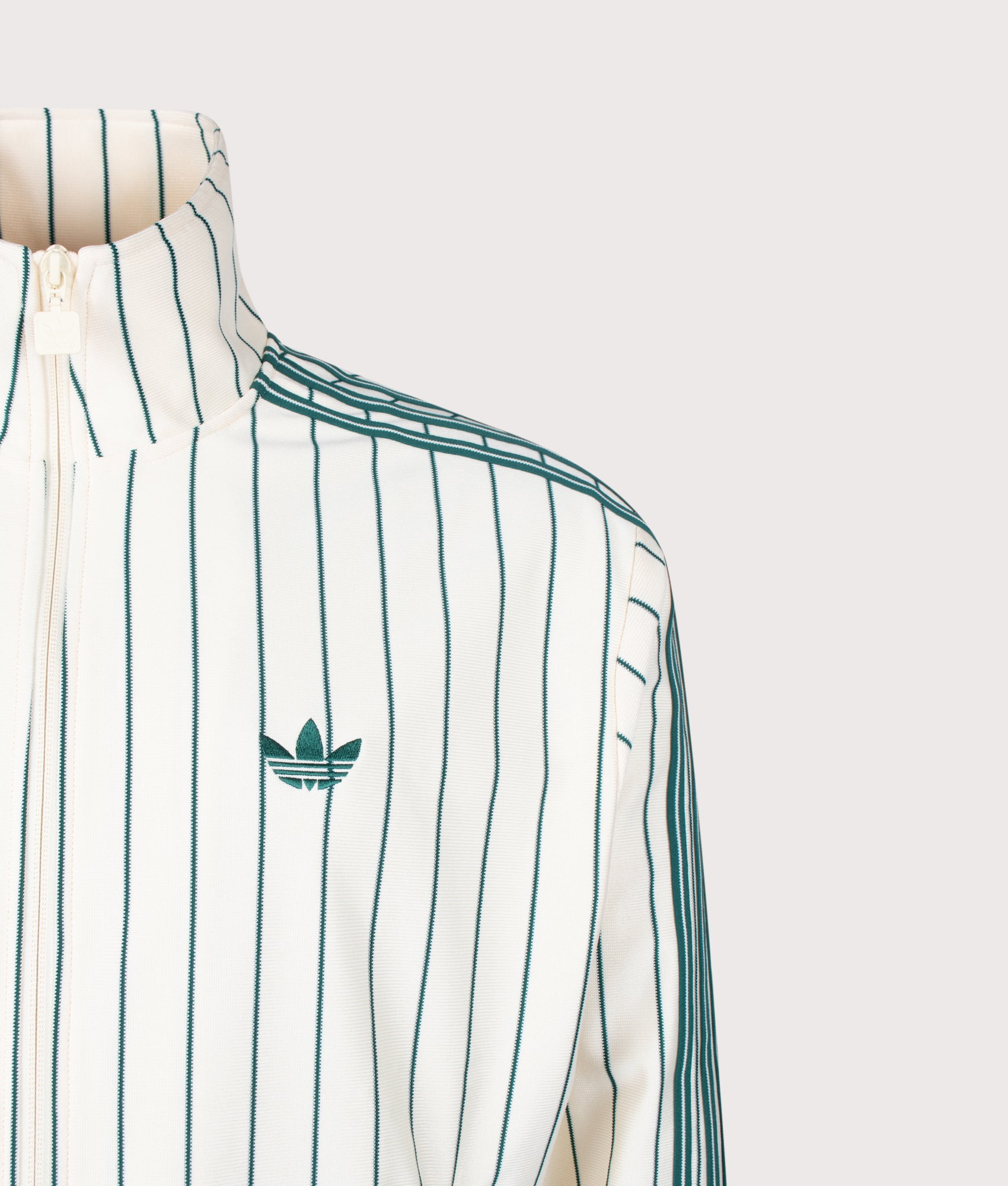 adidas Originals Loose Fit Firebird Pinstripe Track Top in in Pin stripe Warm Vanilla at EQVVS Menswear. Detail shot.