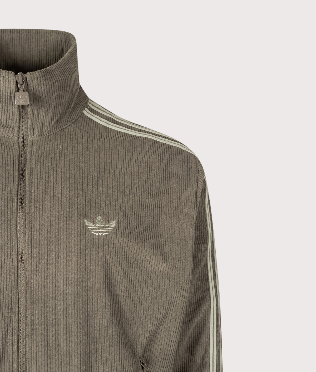 adidas Originals Loose Fit Firebird Corduroy Track Top in Branch at EQVVS Menswear. Detail shot.