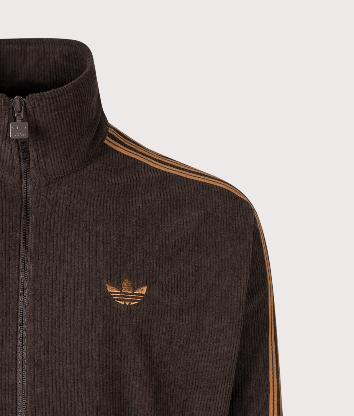 adidas Originals Loose Fit Firebird Corduroy Track Top in Aurora Coffee at EQVVS Menswear. Detail shot.