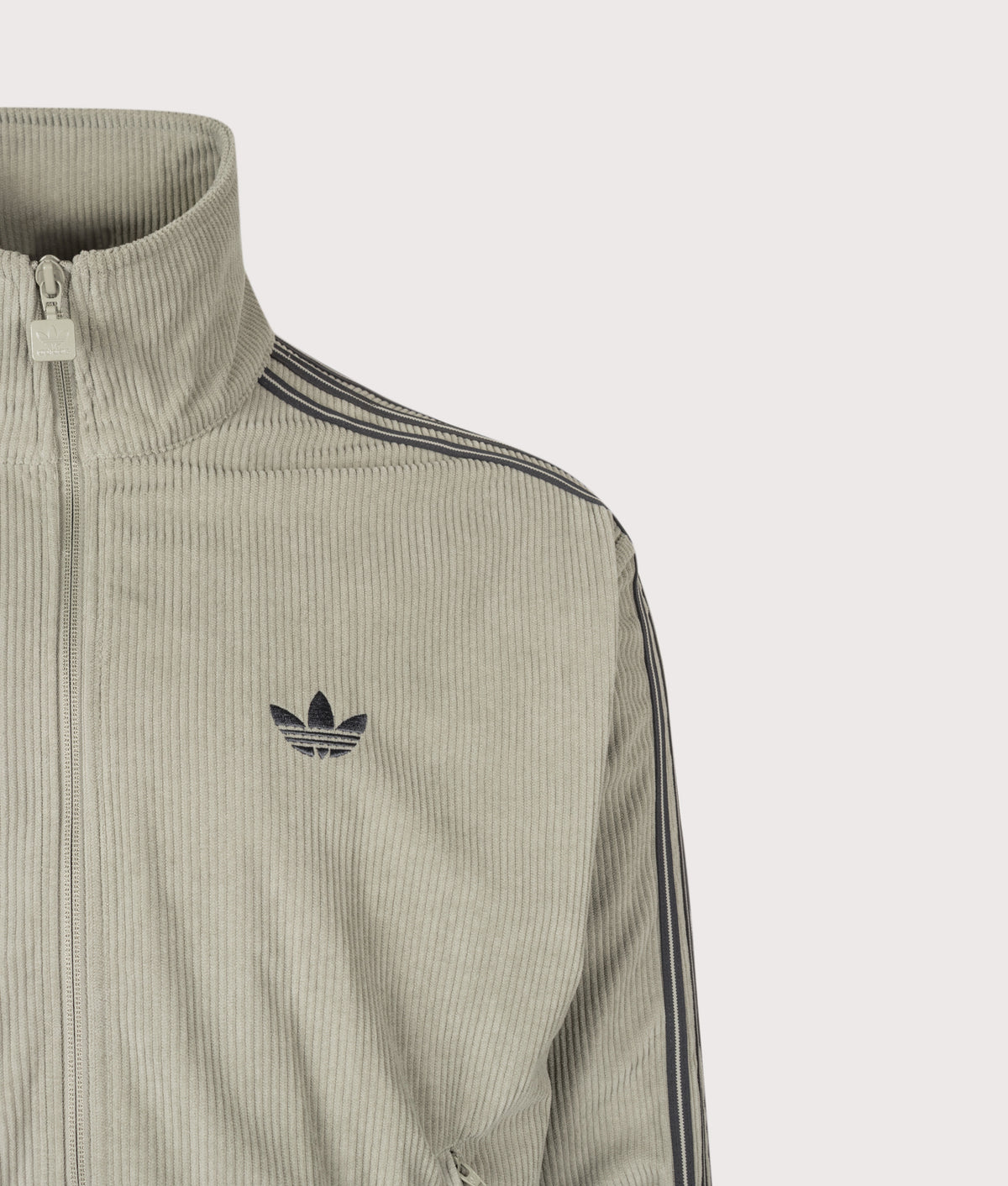 adidas Originals Loose Fit Firebird Corduroy Track Top in Silver Pebble at EQVVS Menswear. Detail shot.