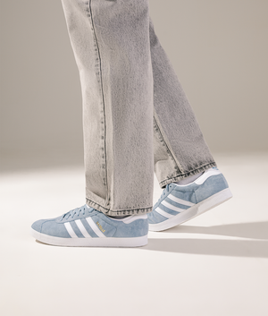 Adidas Originals Gazelle in Tactile Blue/Footwear White/Gold Metallic at EQVVS Menswear. Campaign shot.