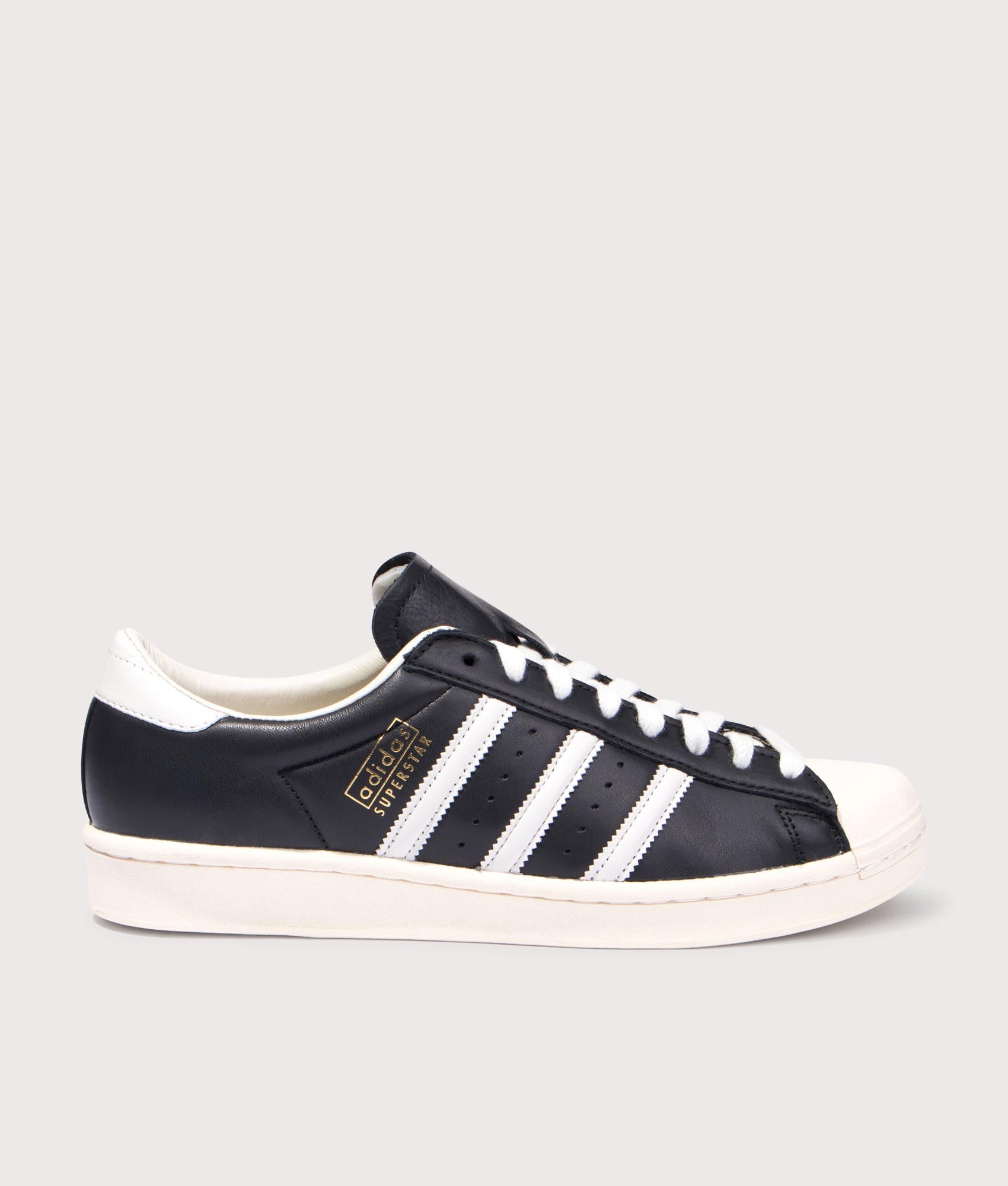 adidas Originals Superstar Vintage Trainers in Core Black, Cloud White and Cream White at EQVVS Menswear. Side shot.