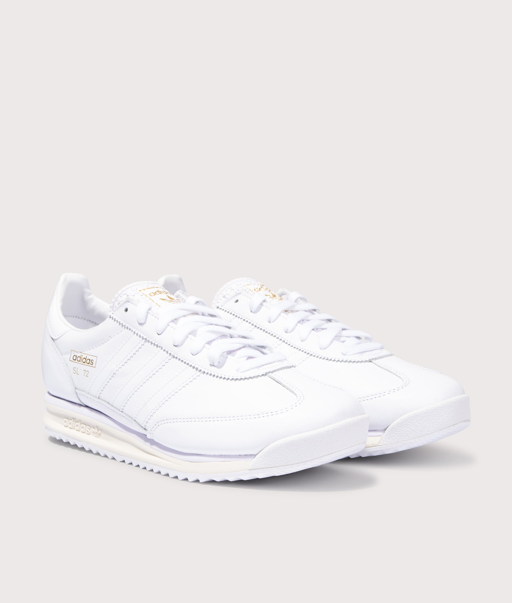 SL 72 RS Trainers in Footwear White/Footwear White/Off White | adidas Original | EQVVS | Front angle shot