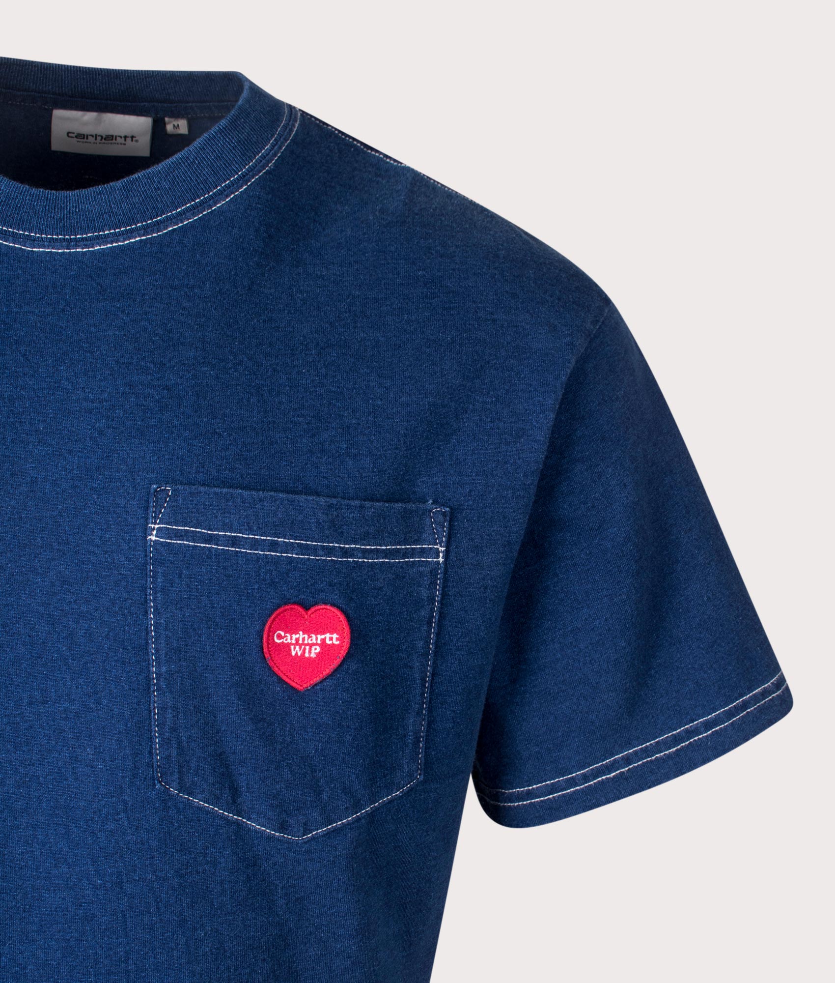 Carhartt WIP Relaxed Fit Ingo Pocket T-Shirt in Dark Blue, 100% Cotton at EQVVS. Close-up shot. 