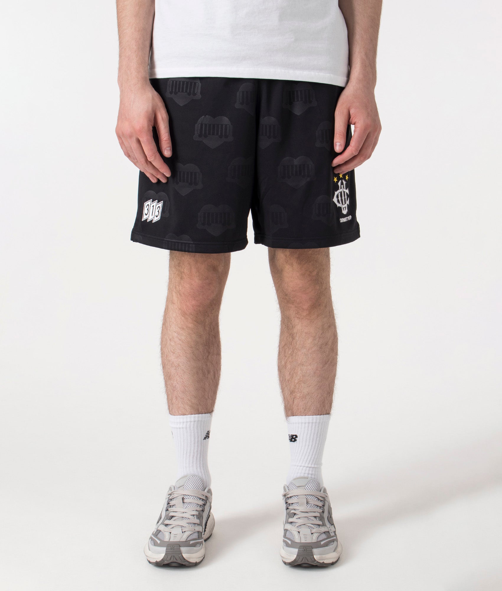 Carhartt WIP Relaxed Fit Hartt Football Shorts in Black at EQVVS Menswear. Front shot. 