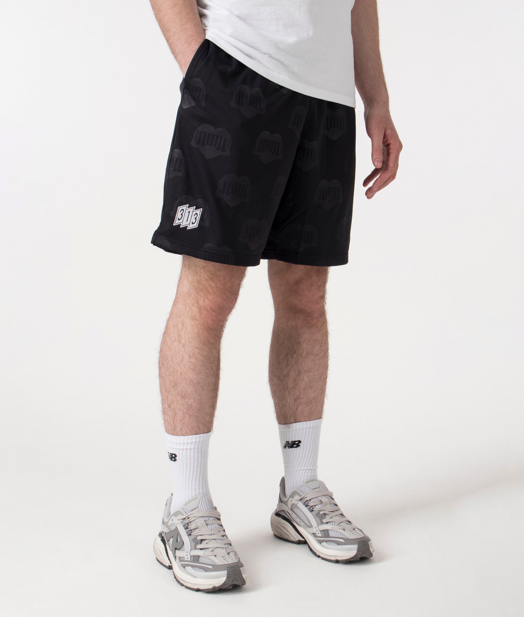 Carhartt WIP Relaxed Fit Hartt Football Shorts in Black at EQVVS Menswear. Right side shot. 