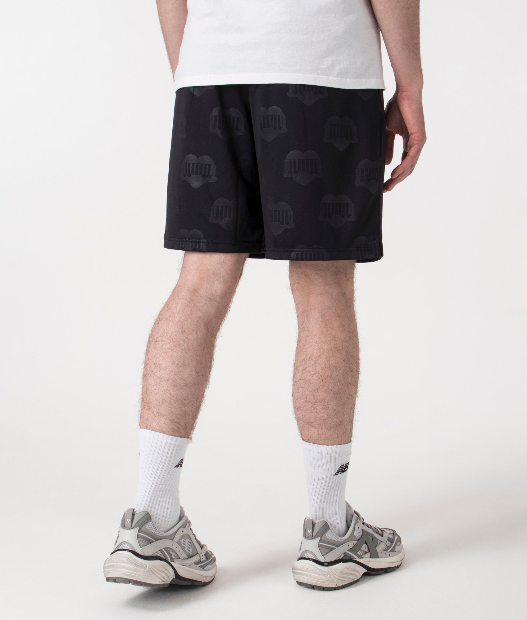Carhartt WIP Relaxed Fit Hartt Football Shorts in Black at EQVVS Menswear. Back shot. 