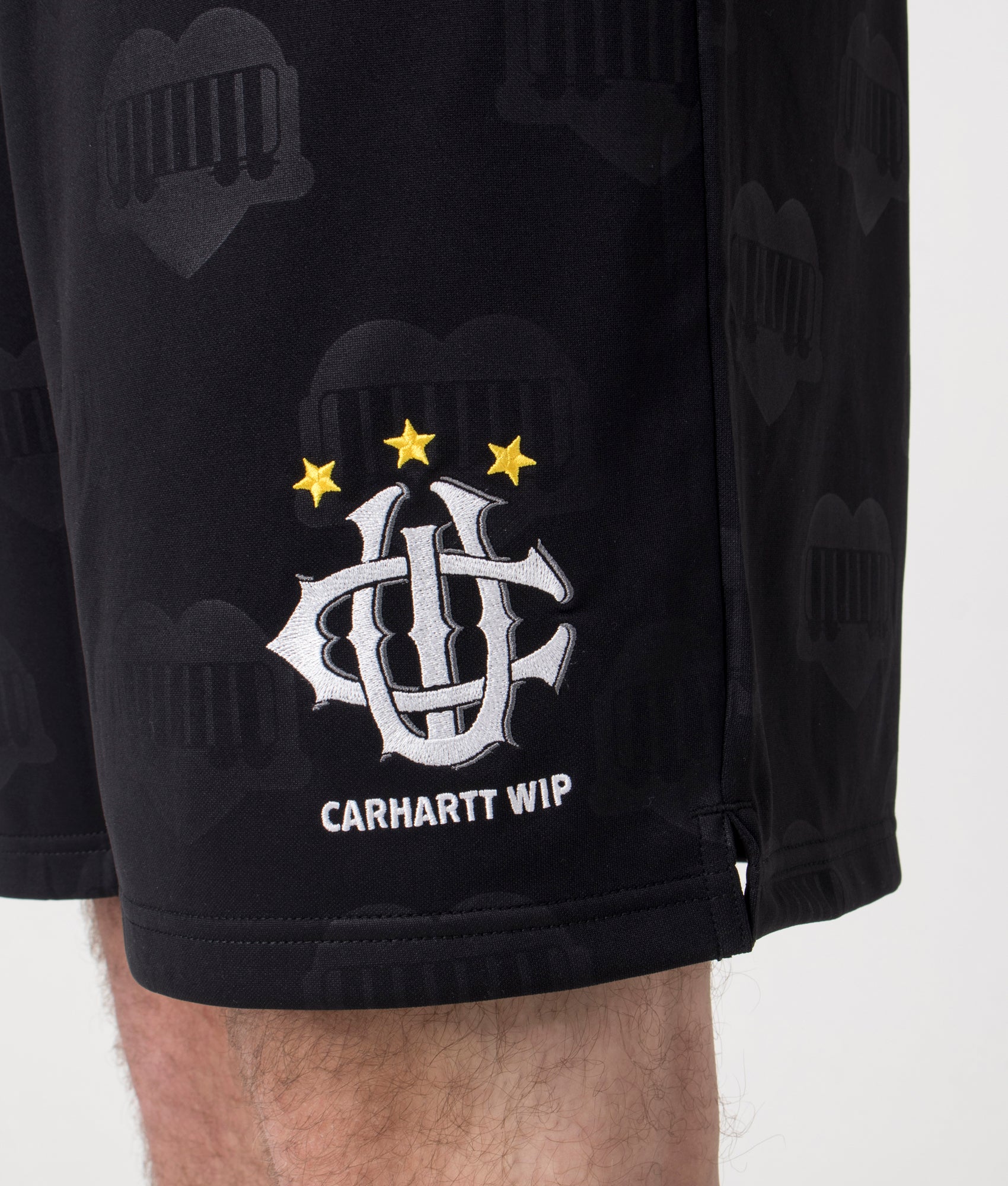 Carhartt WIP Relaxed Fit Hartt Football Shorts in Black at EQVVS Menswear. Detailed shot. 
