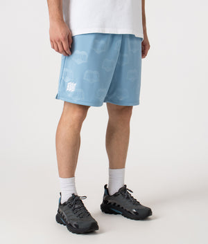 Relaxed Fit Hartt Football Shorts in Heart Train Jacquard and Bluebird. | Carhartt WIP | Shot at EQVVS | Front right angle shot 