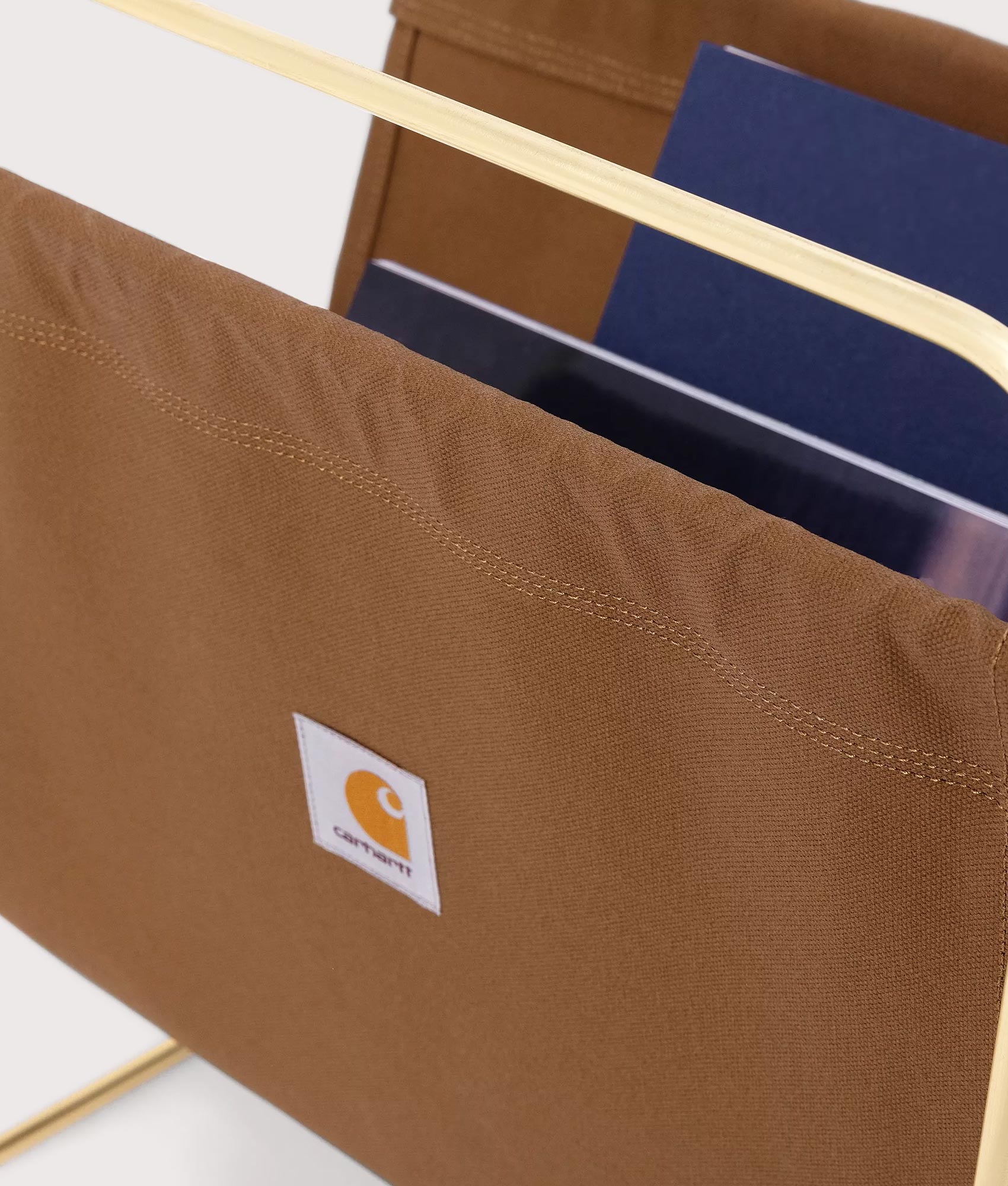 Carhartt WIP Canvas Magazine Stand in Hamilton Brown, 100% Cotton at EQVVS. Detailed logo shot. 