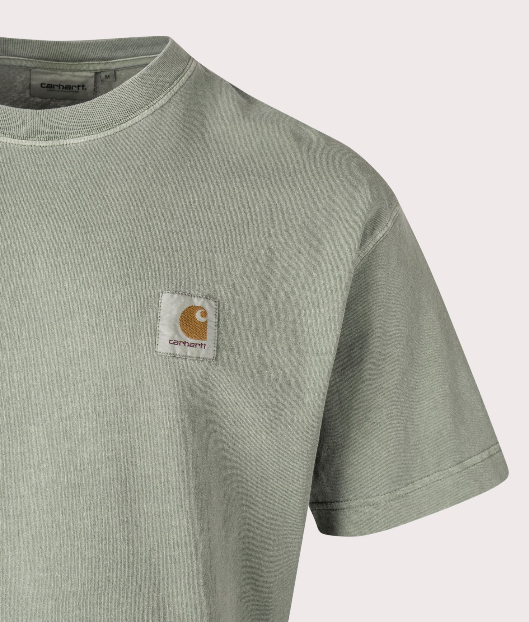 Carhartt WIP Relaxed Fit Nelson T-Shirt in Park, 100% Cotton at EQVVS. Close-up shot. 