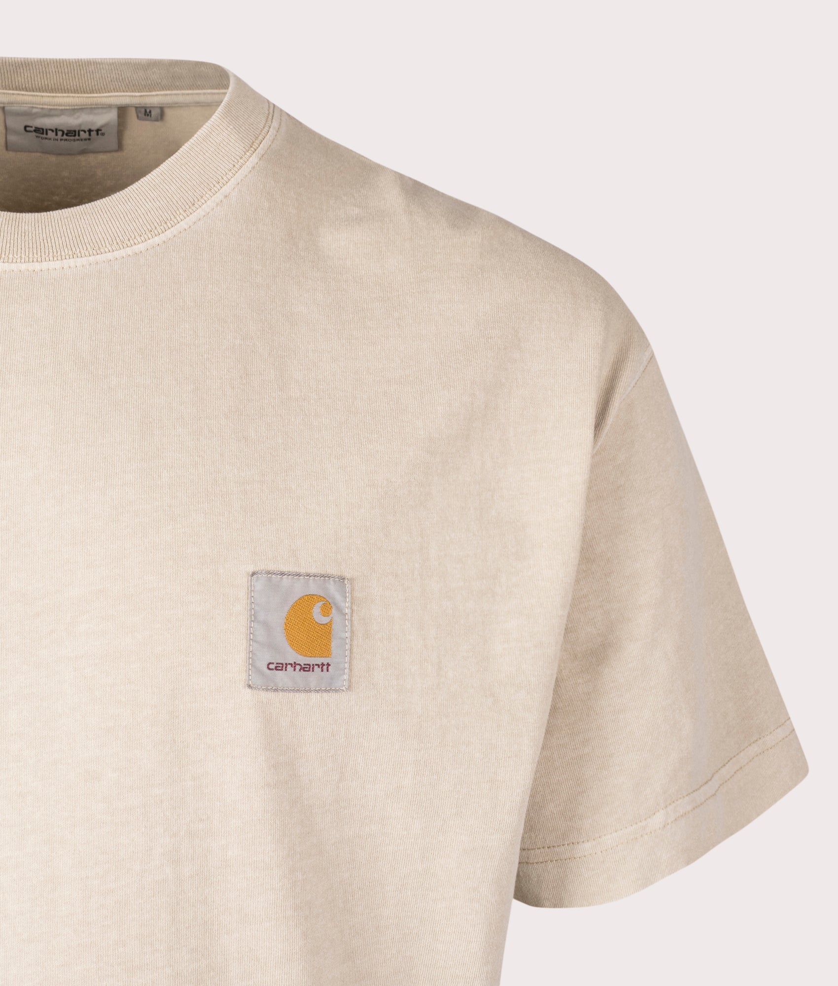 Carhartt WIP Relaxed Fit Nelson T-Shirt in Fleur De Sel, 100% Cotton at EQVVS. Close-up shot.