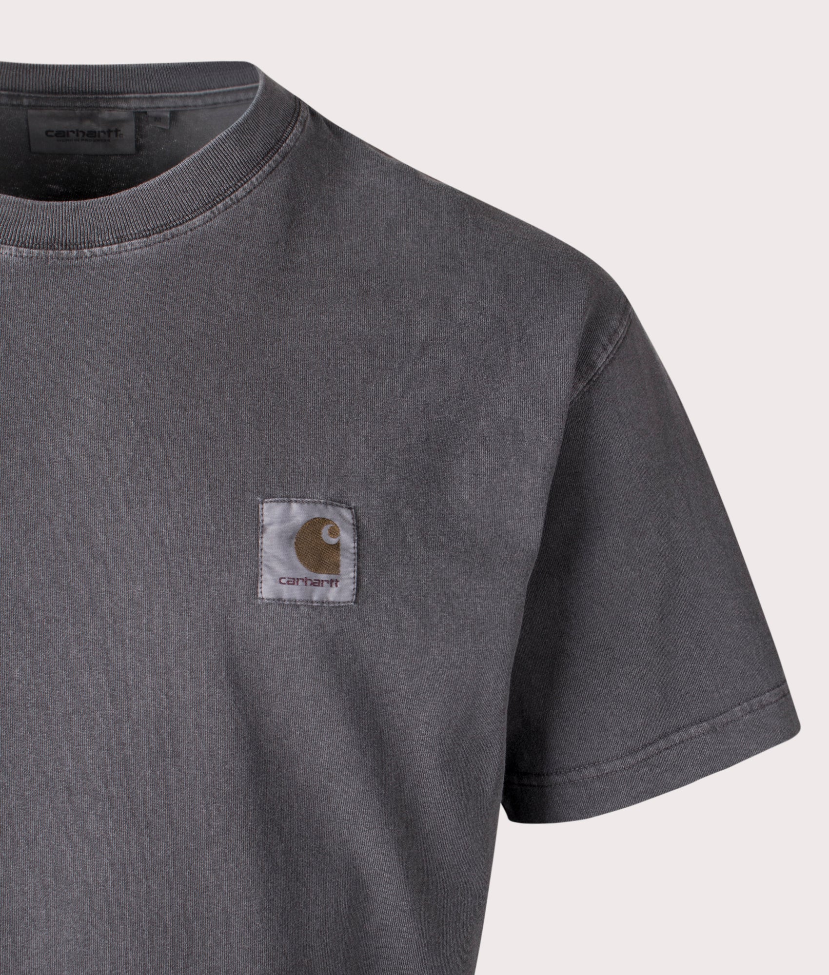 Carhartt WIP Relaxed Fit Nelson T-Shirt in Graphite, 100% Cotton at EQVVS. Close-up shot. 