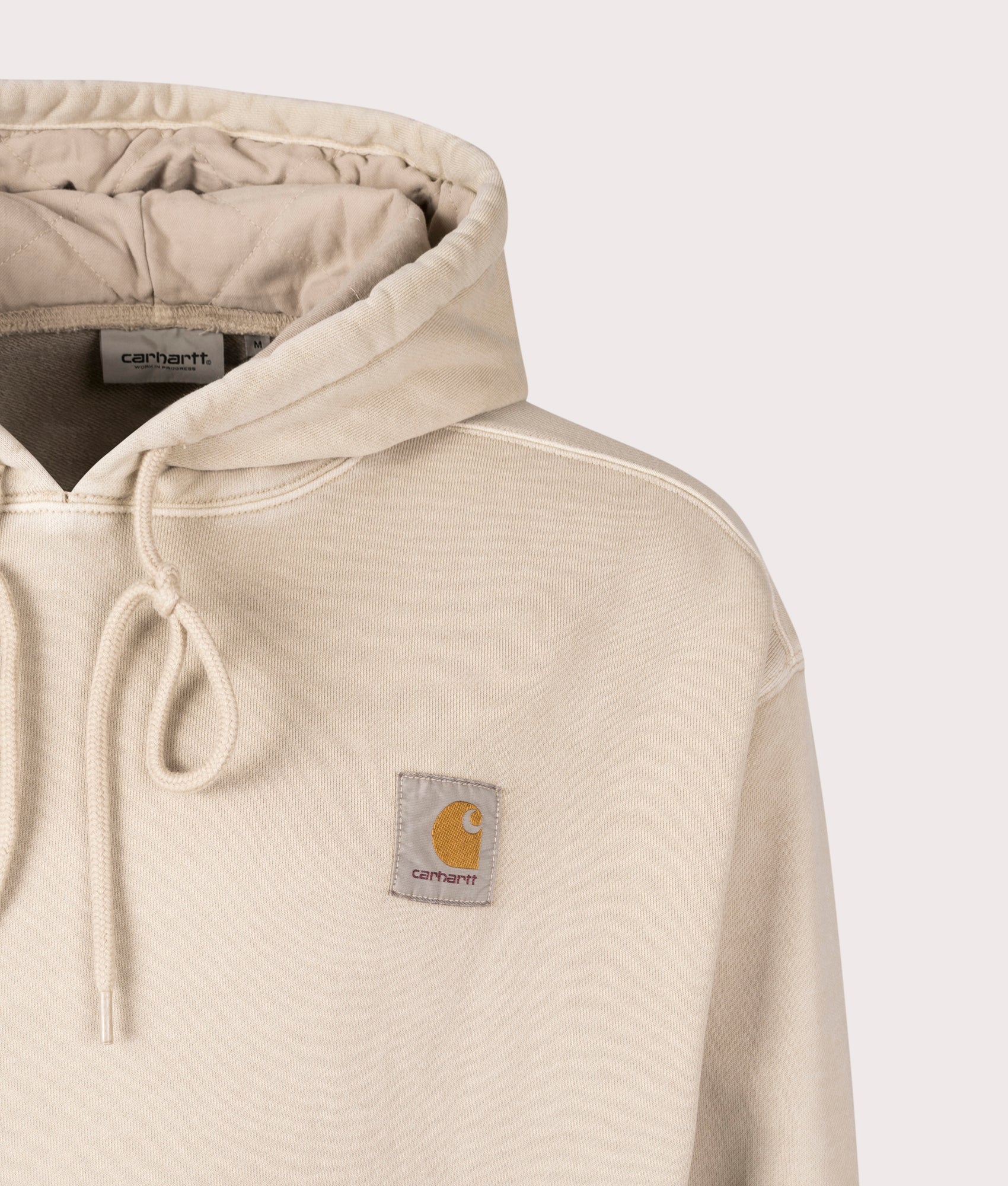 Carhartt WIP Oversized Nelson Hoodie in Fleur De Sel, 100% Cotton at EQVVS. Close-up shot. 