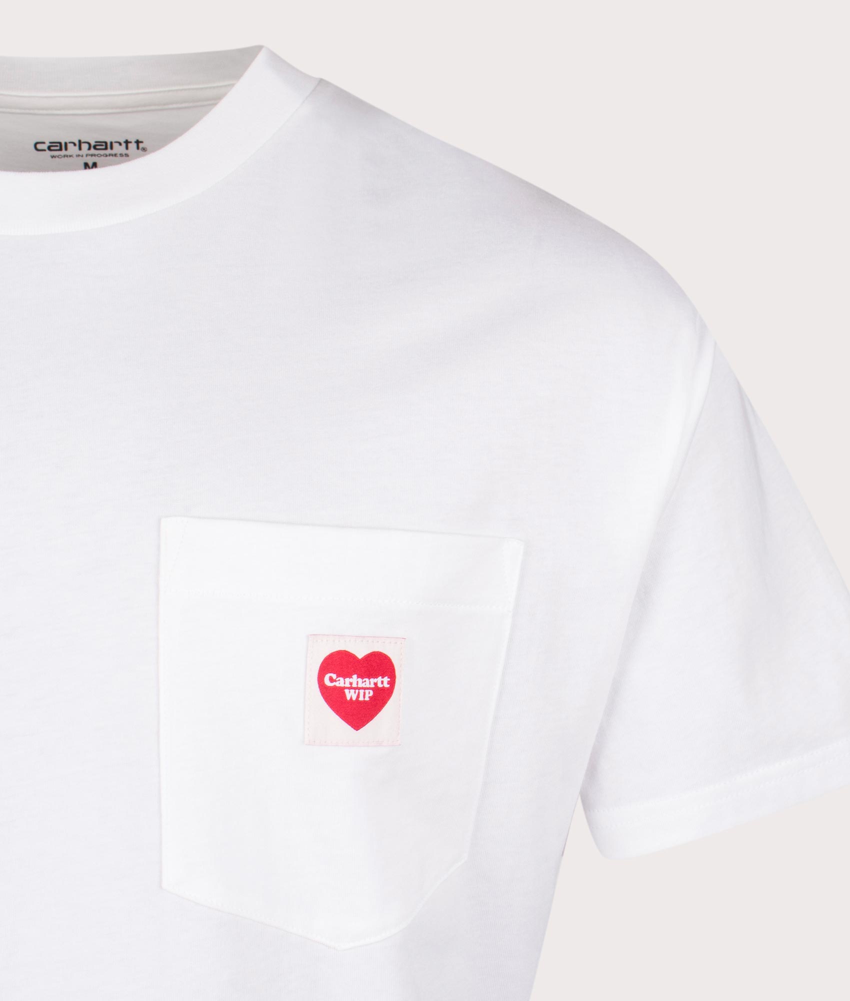 Carhartt WIP Loose Fit Pocket Heart T-Shirt in White at EQVVS Menswear. Detail shot.