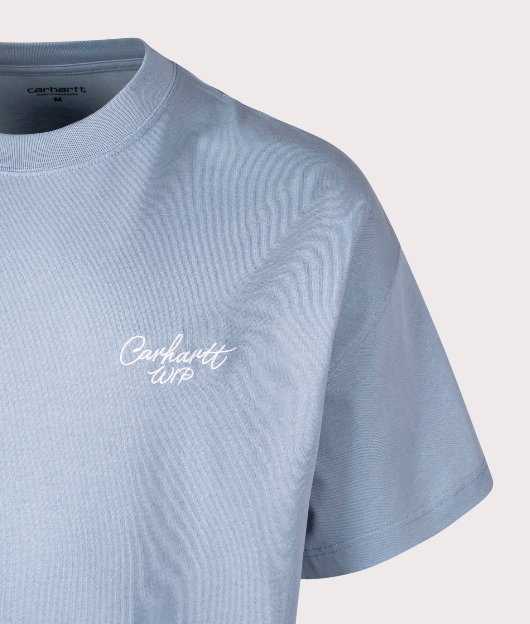 Carhartt WIP Signature Script T-Shirt in Frosty Blue at EQVVS Menswear. Detail shot.