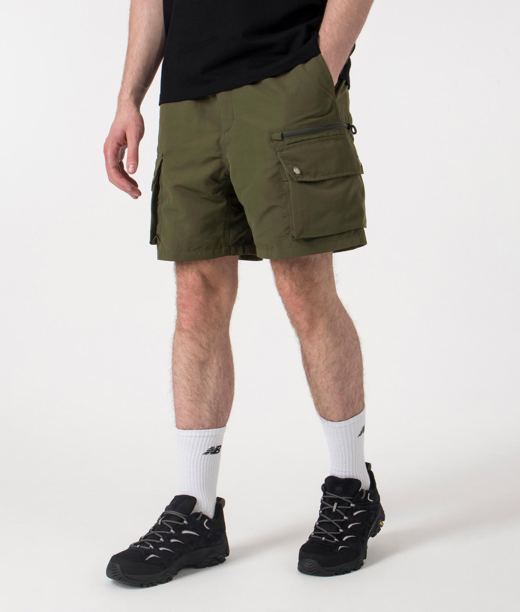 Carhartt WIP Regular Fit Irwin Shorts in Turtle at EQVVS. Left side shot.