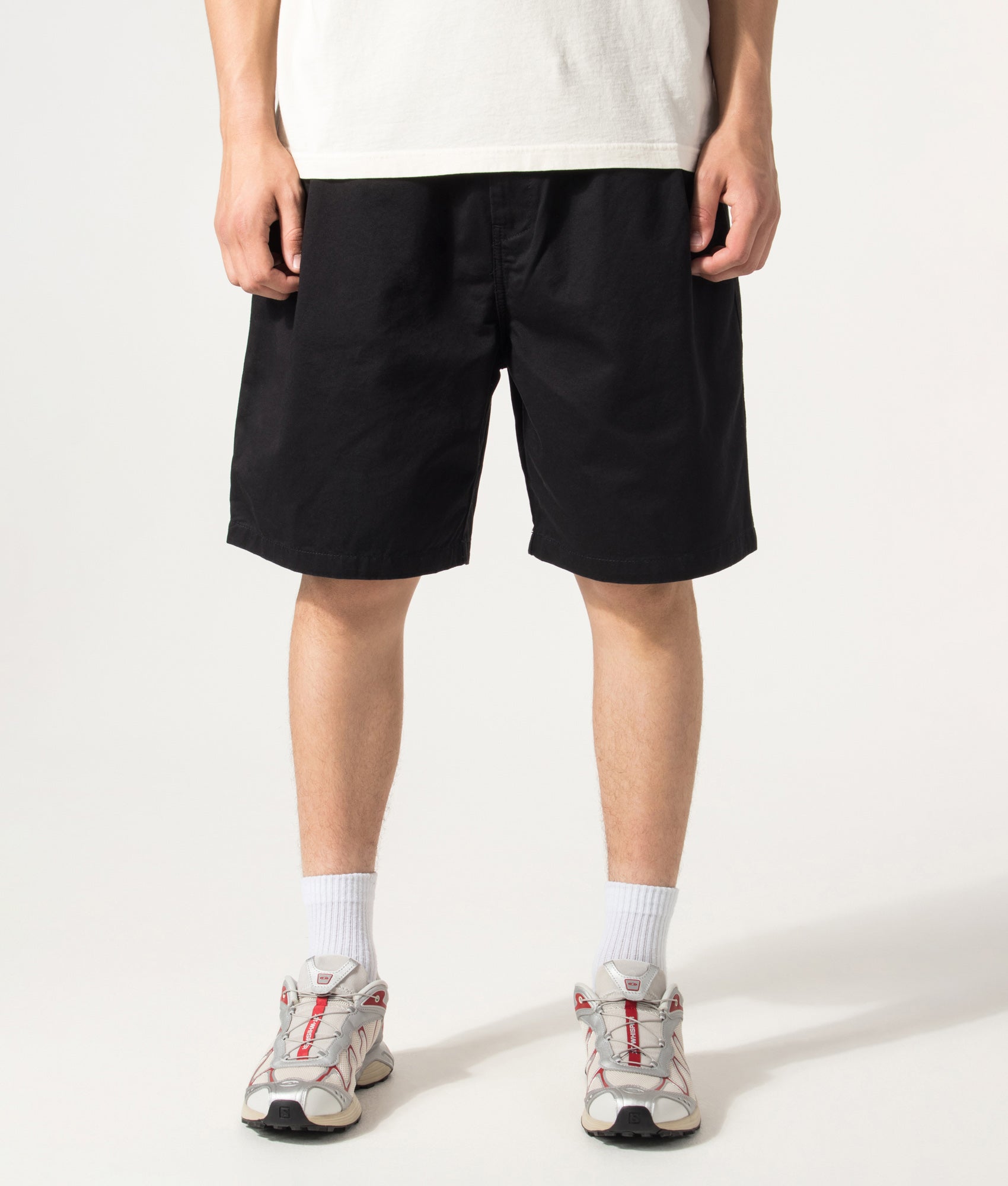 Carhartt WIP Marv Shorts in Stone Washed Black at EQVVS Menswear. Model front shot.