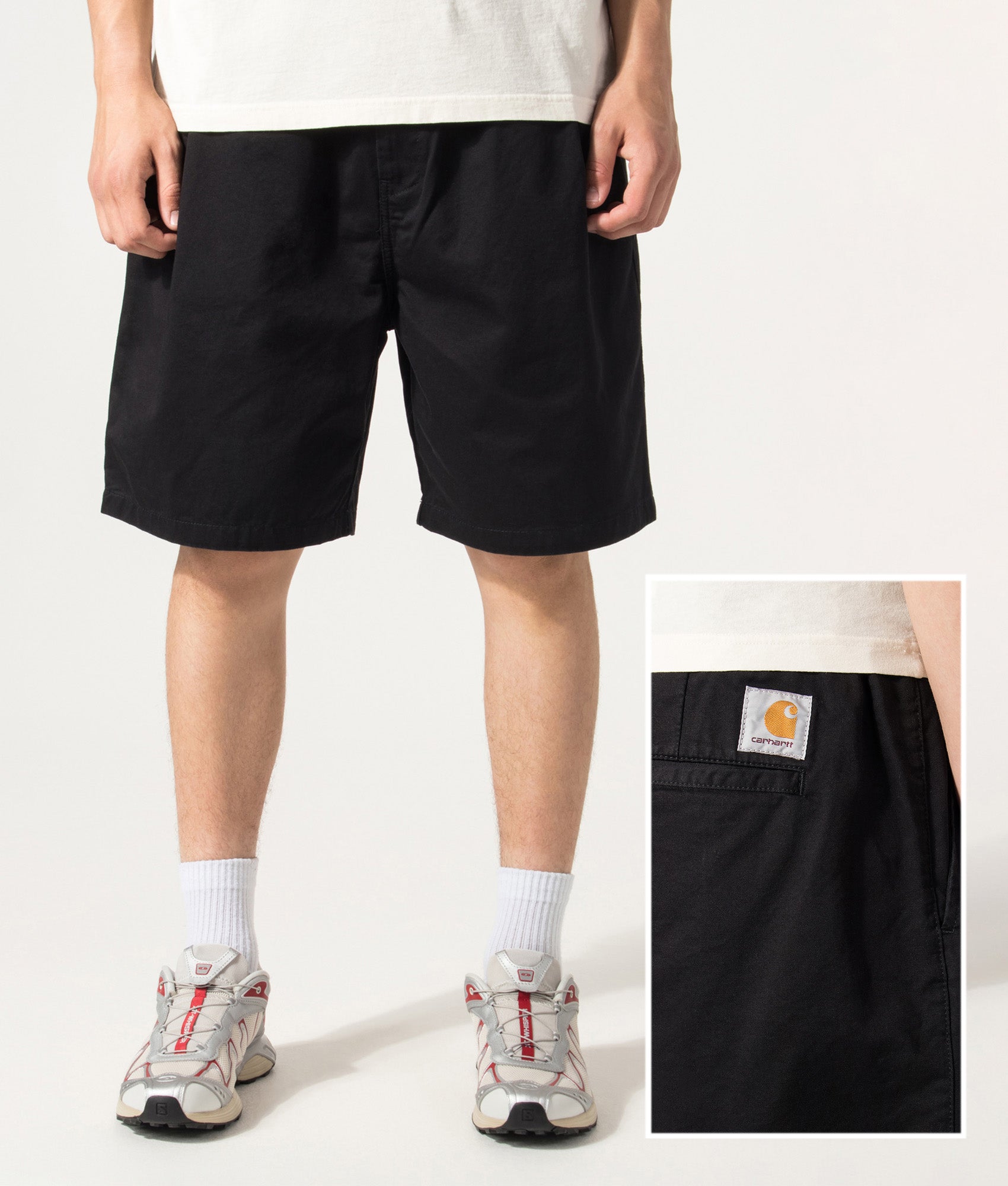 Carhartt WIP Marv Shorts in Stone Washed Black at EQVVS Menswear. Model front and detail shot.