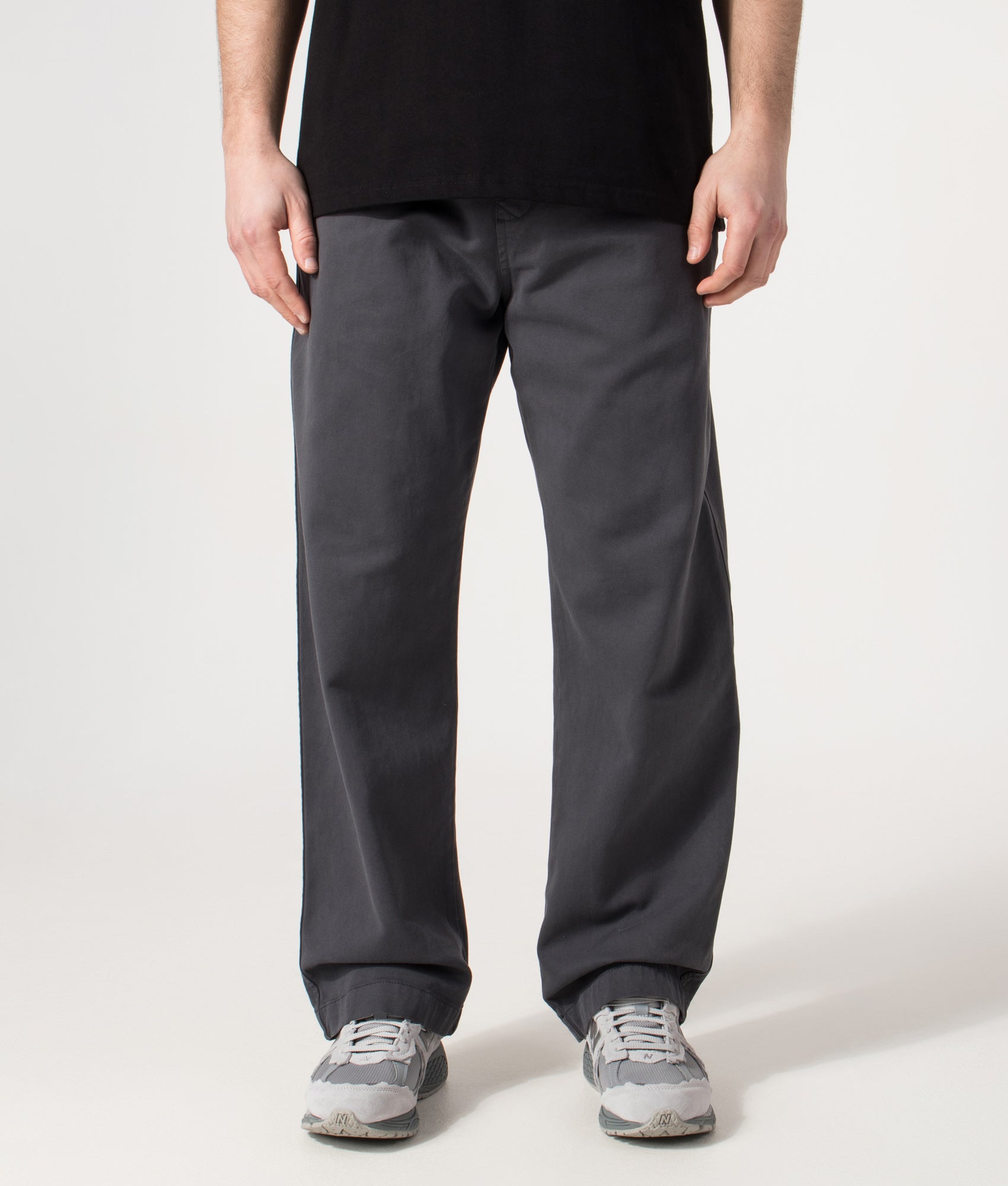 Carhartt WIP Relaxed Fit Floyde Pants in  Graphite at EQVVS Menswear. Model front shot.