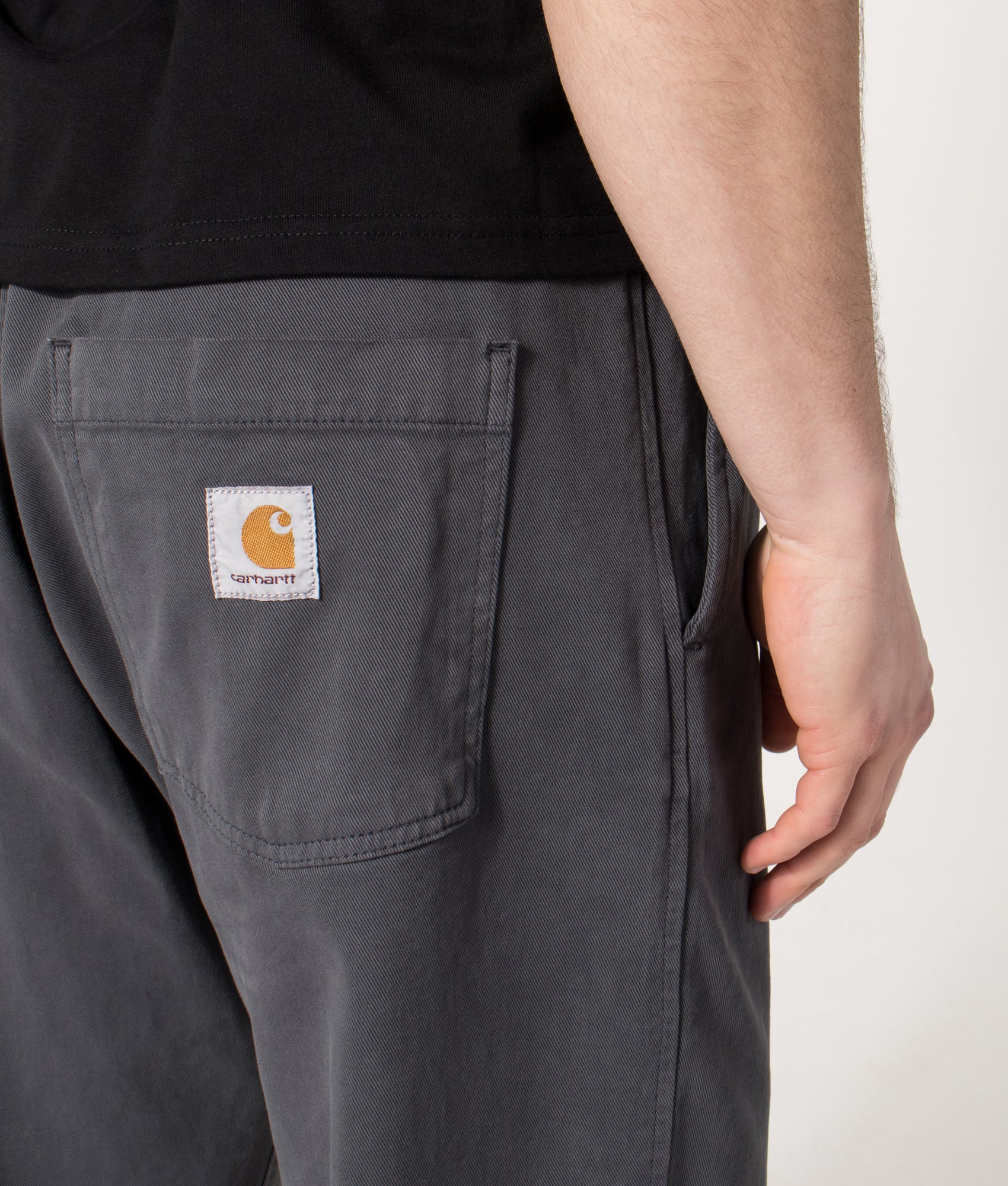 Carhartt WIP Relaxed Fit Floyde Pants in  Graphite at EQVVS Menswear. Back detail shot.