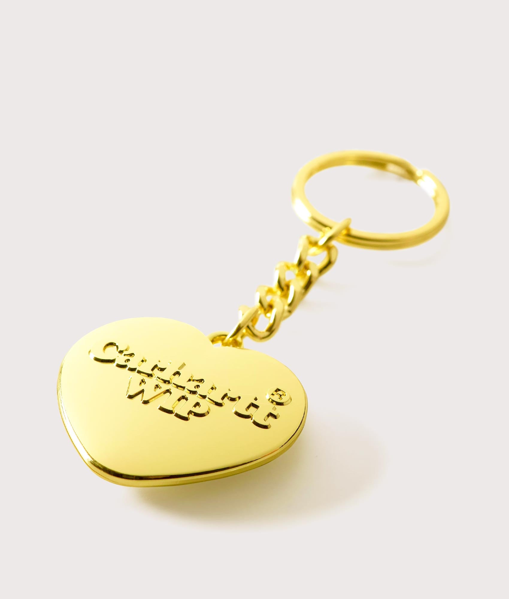 Carharrt WIP  Heart Keychain in Gold. Shot at EQVVS. Angle shot 