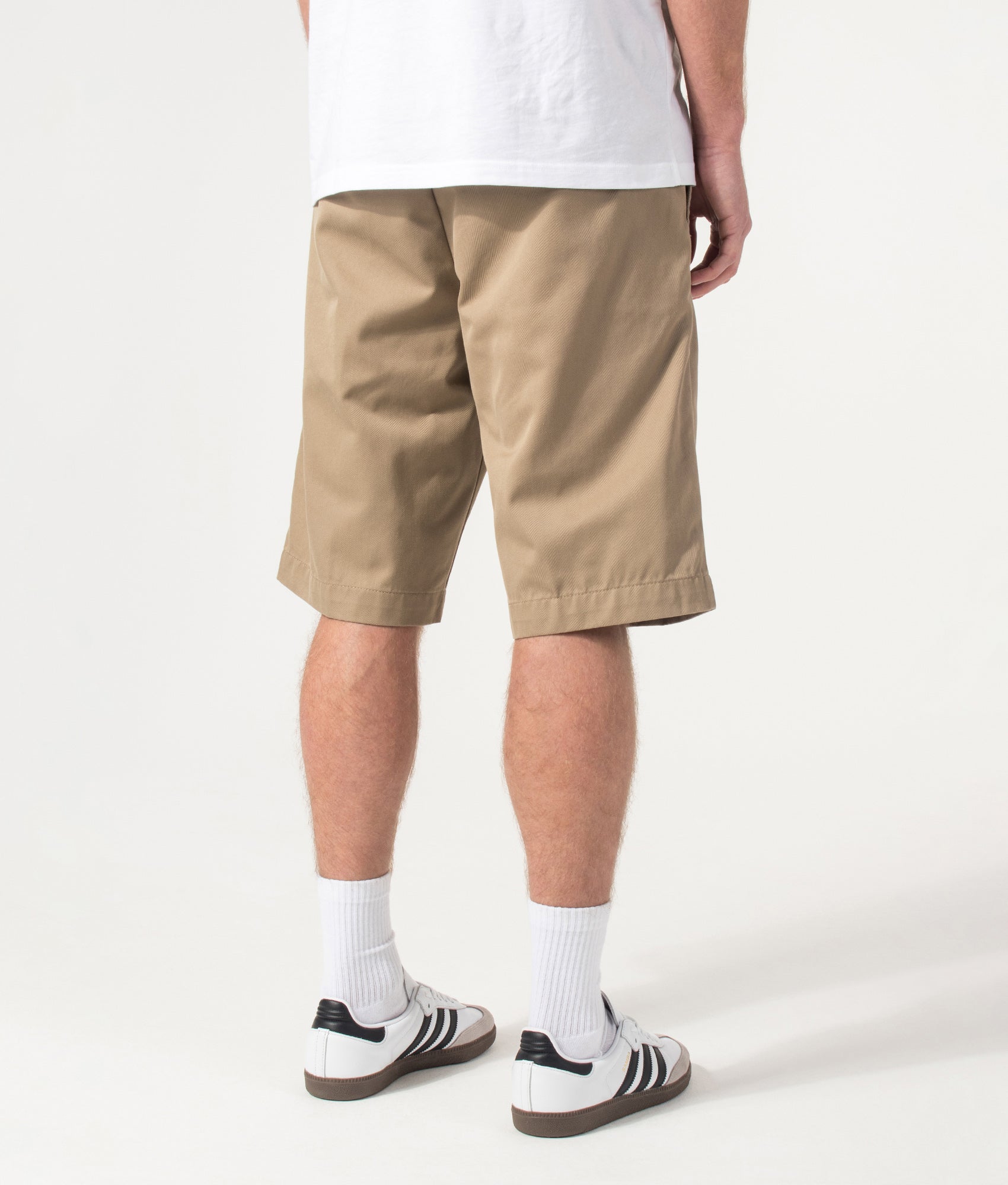 Carhartt WIP Relaxed Fit Master Shorts  in Leather at EQVVS Menswear. Model back shto.
