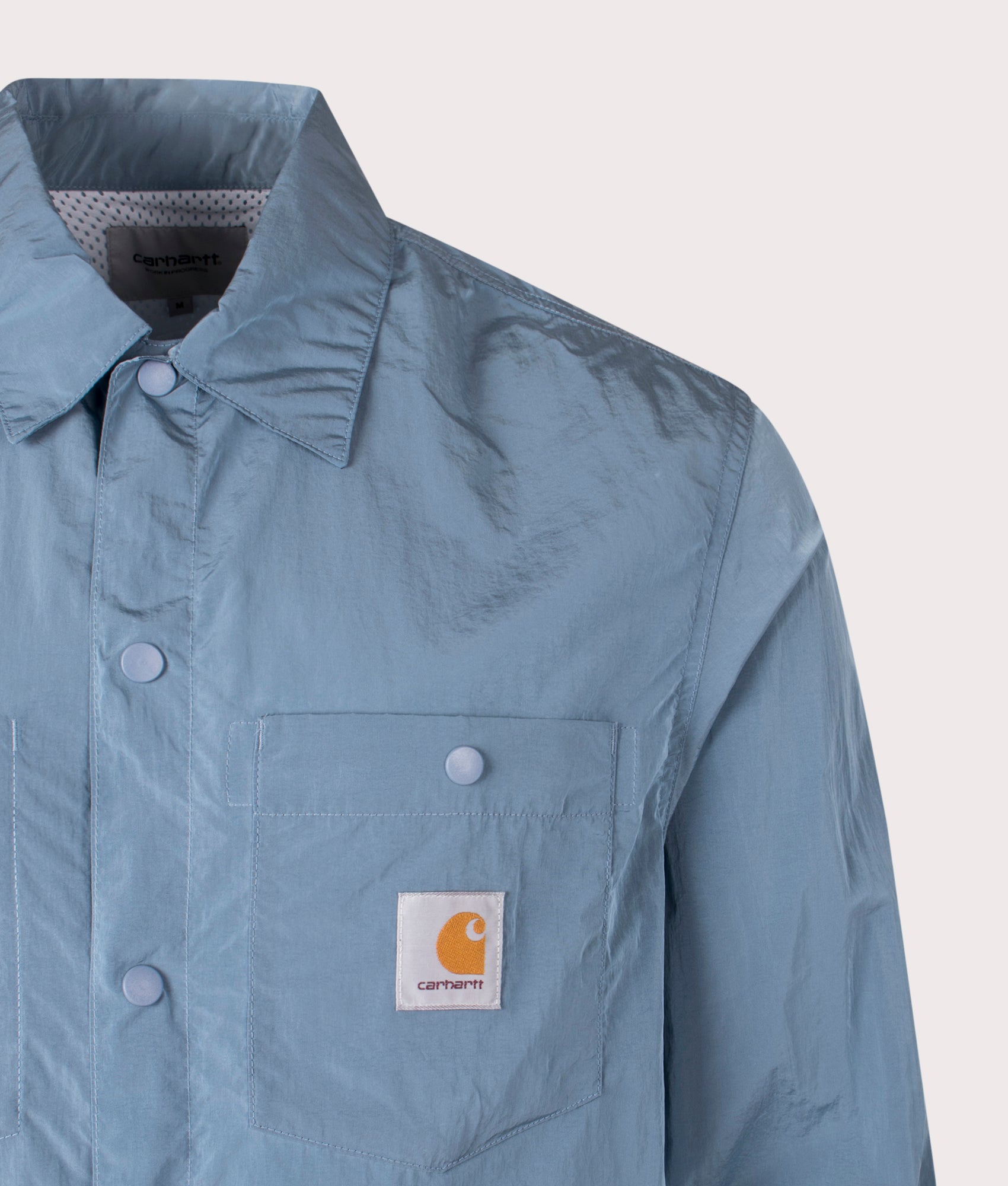 Carhartt WIP Canby Overshirt in Clay Blue/White at EQVVS. Close-up shot. 