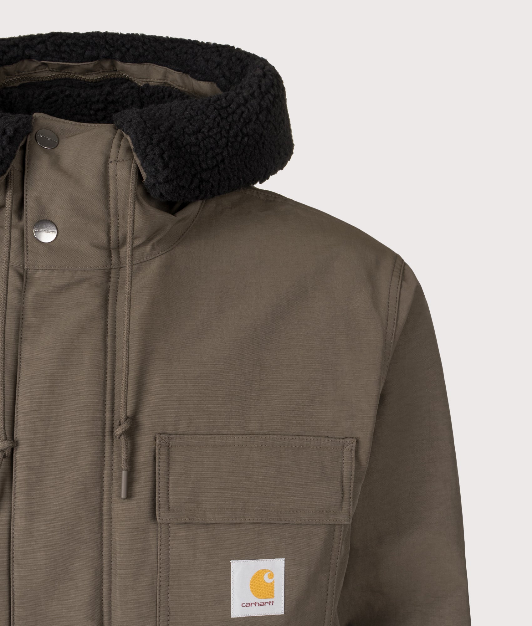 Siberia Parka in Vitola | Carhartt WIP | EQVVS | Front detail shot 
