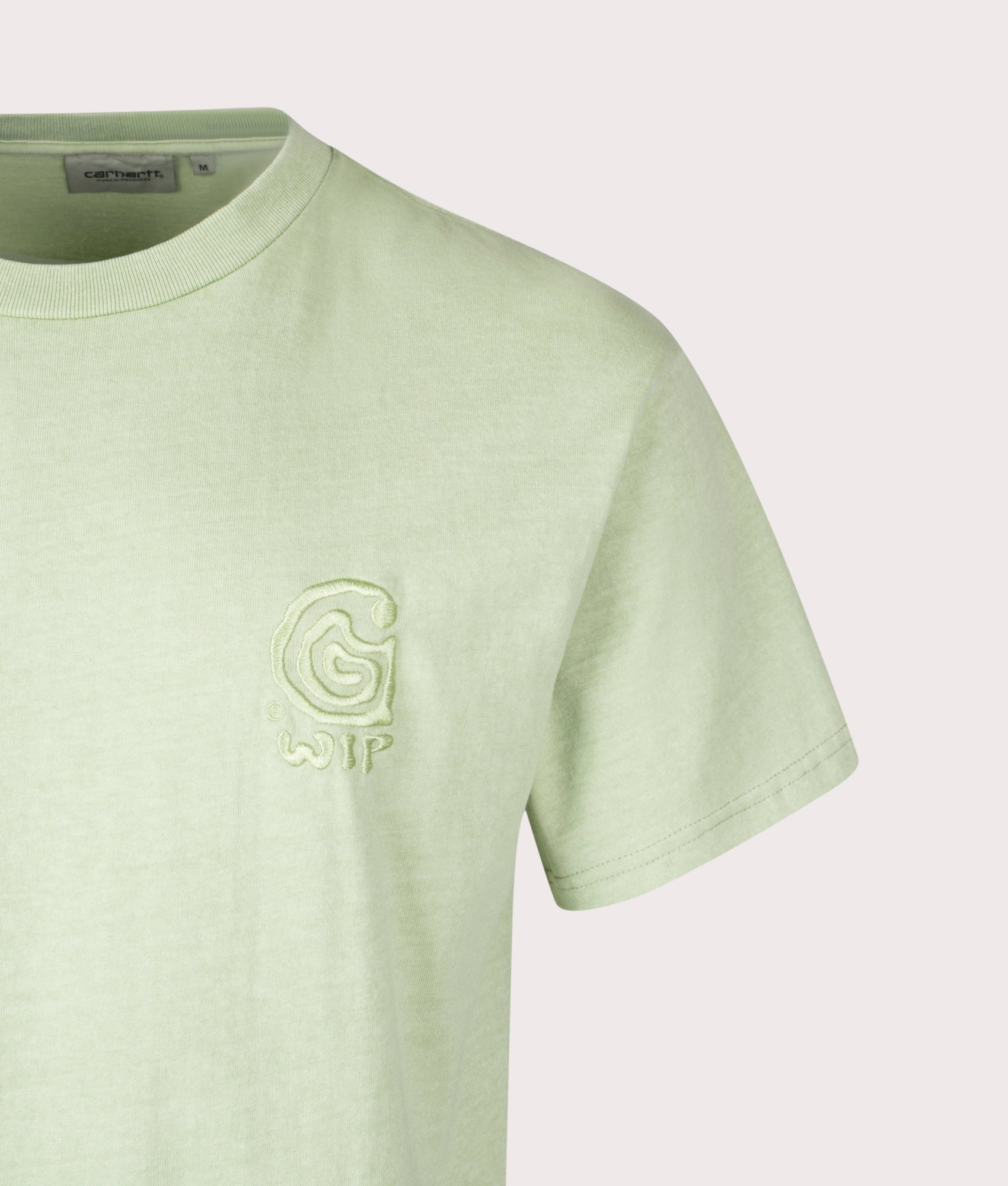 Carhartt WIP Loose Fit Helix Redux T-Shirt in Pale Olive at EQVVS Menswear. Detail shot. 
