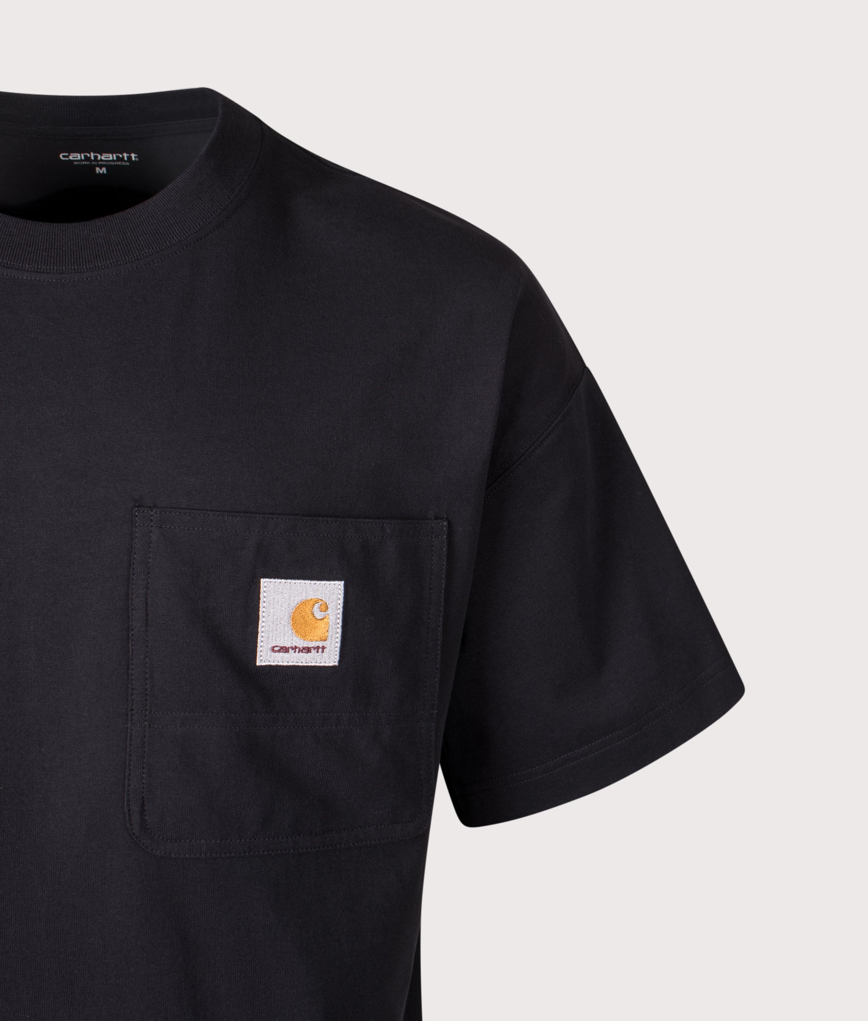 Carhartt WIP Boxy Loose Fit Work Pocket T-Shirt in Black at EQVVS Menswear. Detail shot.